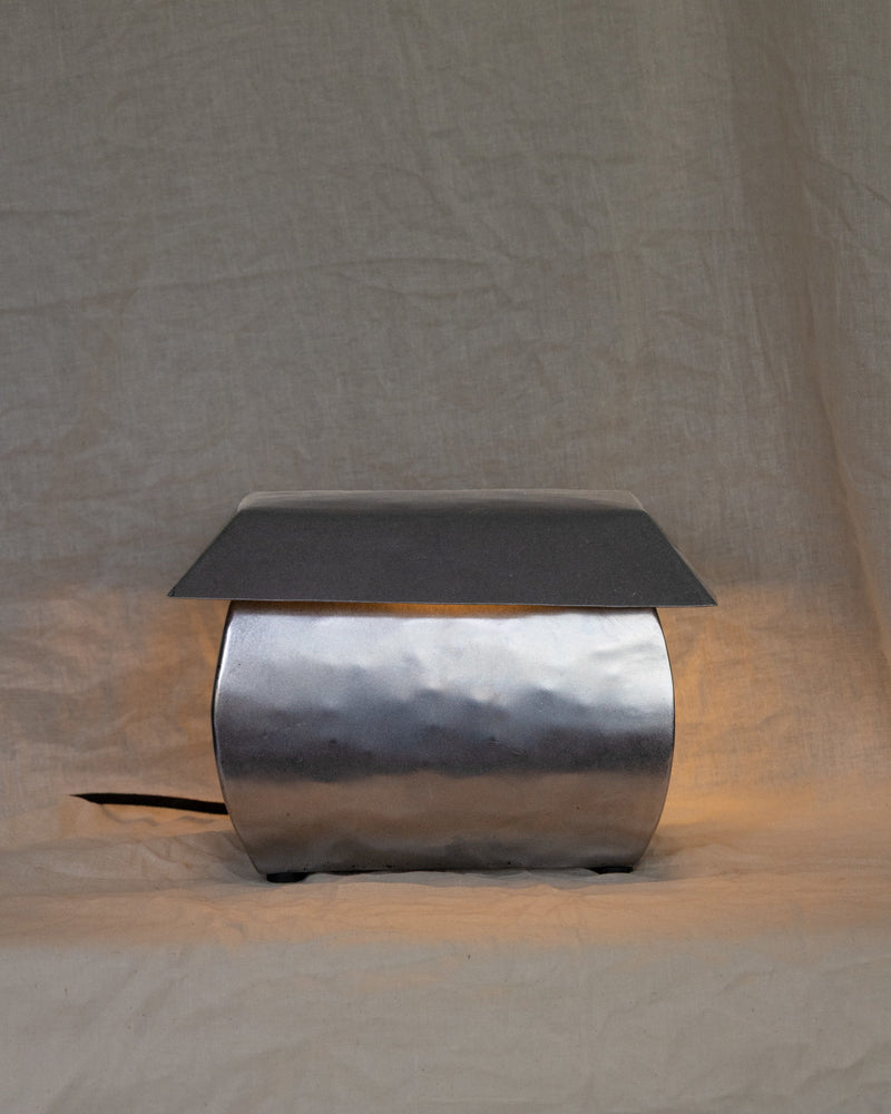 Wide hammered steel table lamp with dark slate top by Jesse Butterfield