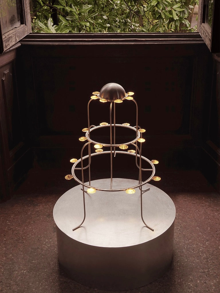 The Lamp With Shells — modern design on circular pedestal in natural light