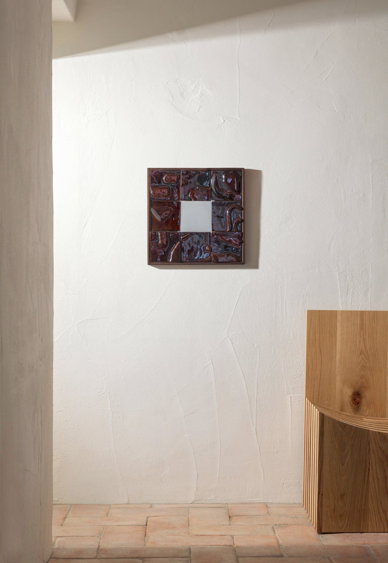Tiled Mirror — close-up of textured brown tiles on wall