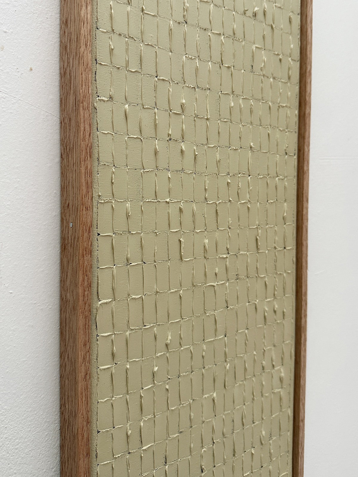 Textured beige abstract painting with crackled grid pattern detail