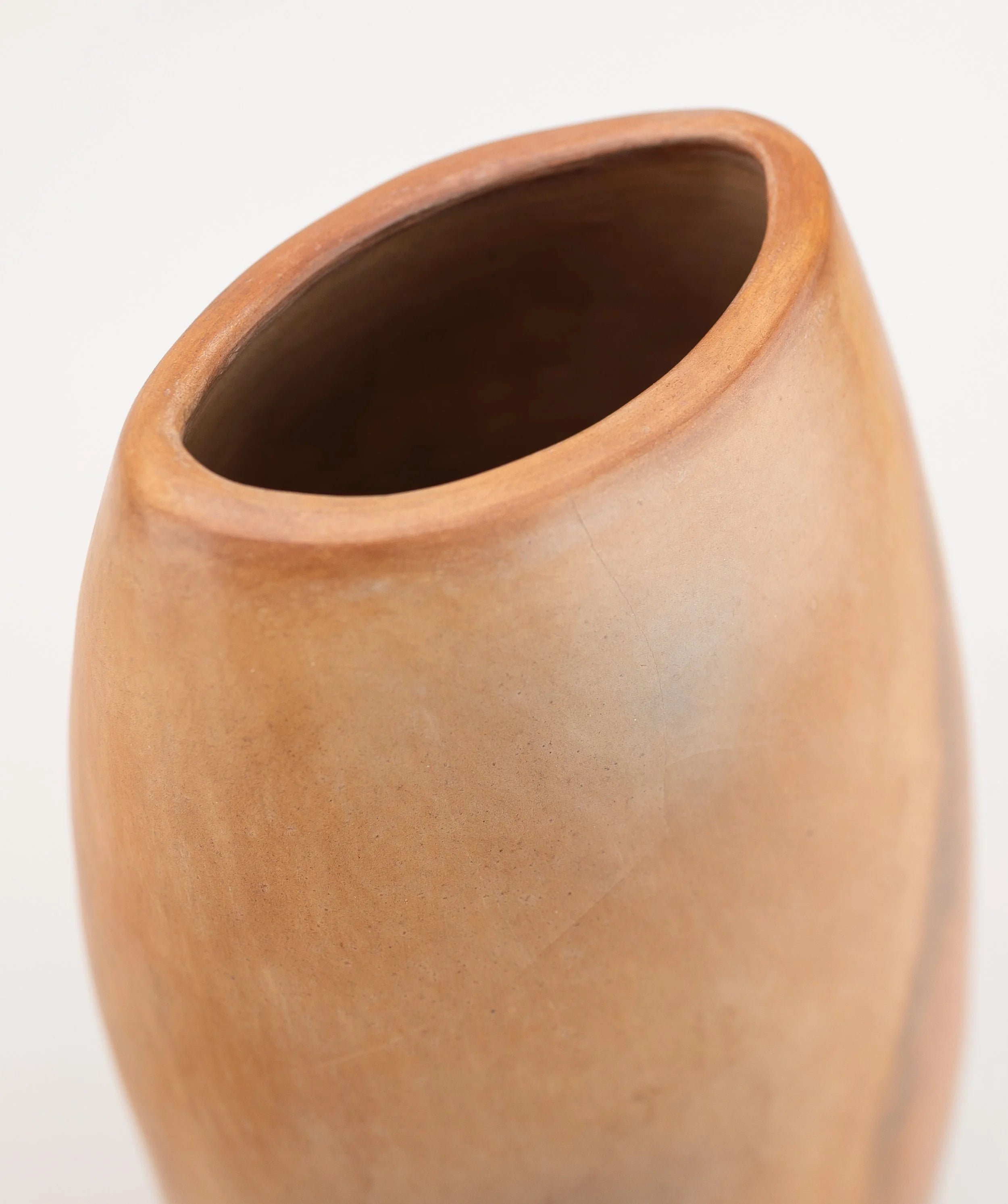 A pair of burnished earthenware decorative vessels — close-up