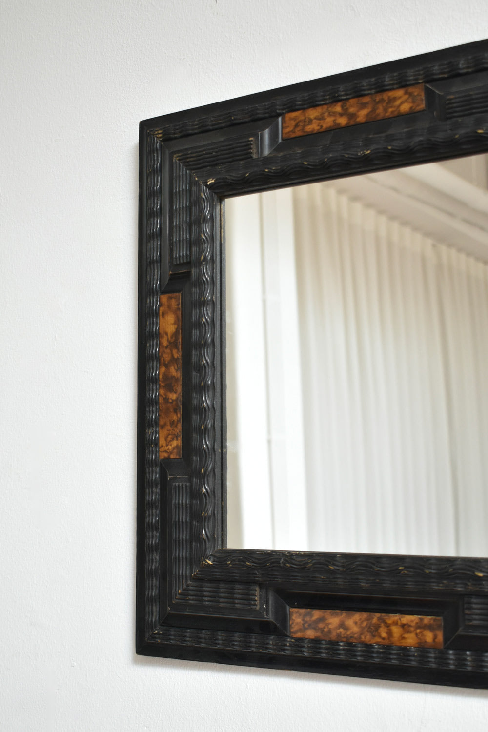 Pair of carved ebonised wood and trompe l'oeil turshell mirrors, XIXth c. — lifestyle setting