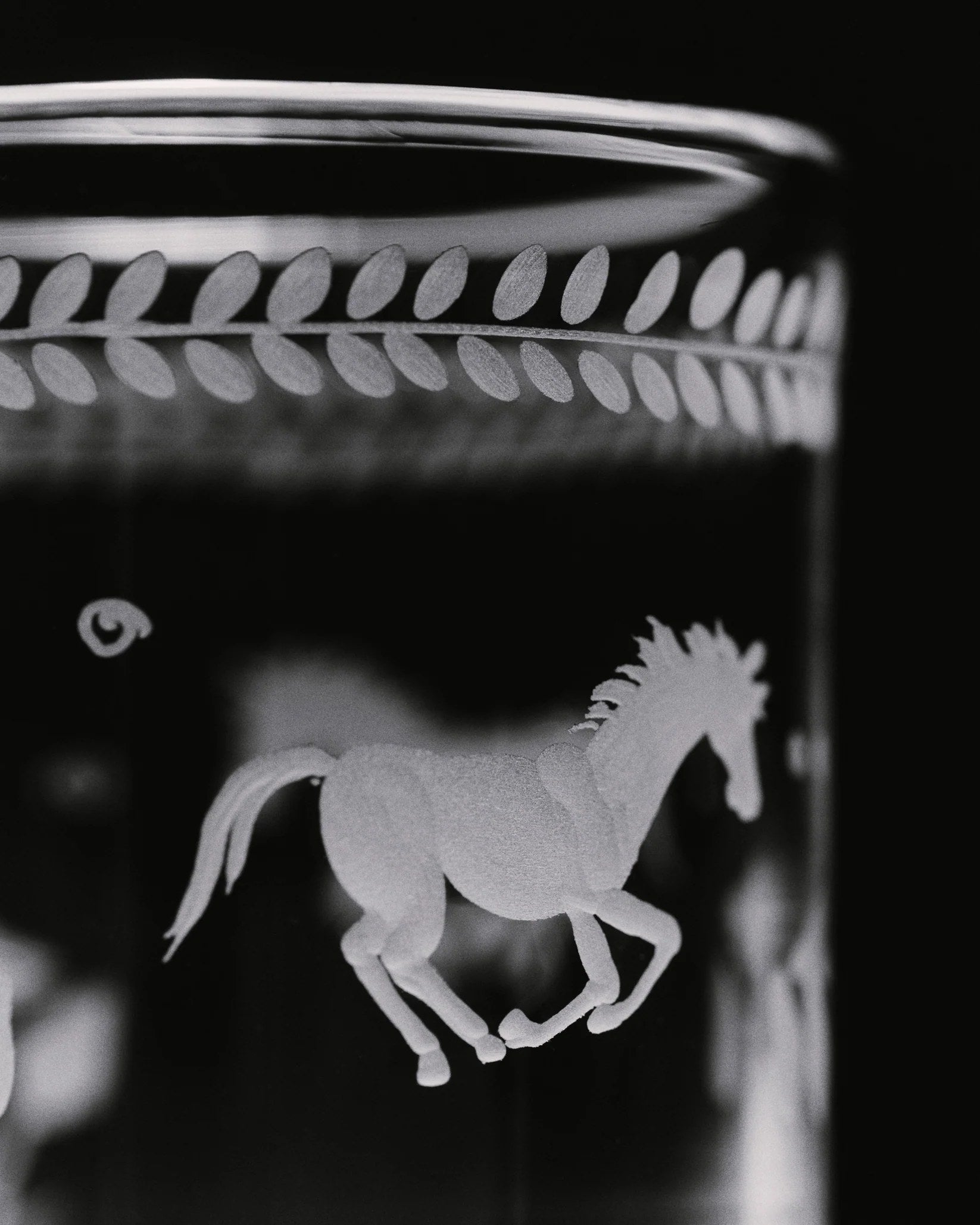 Barbro Water Glass - Set of four — close-up of etched horse design