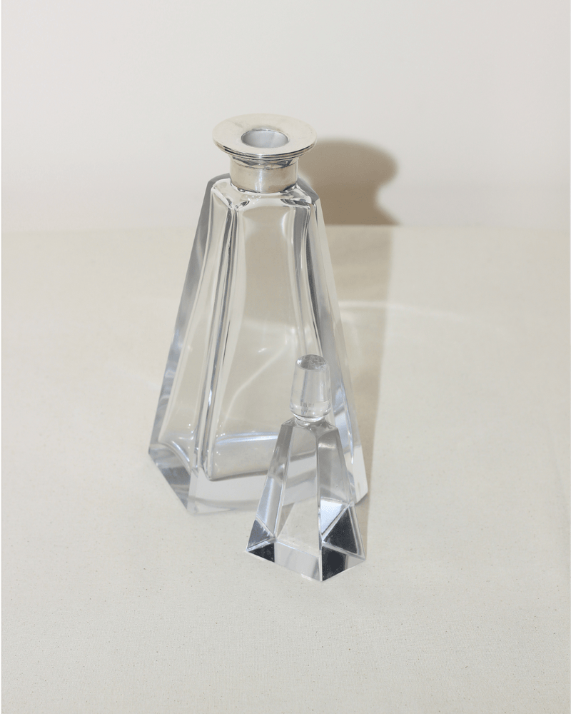 Art Deco Decanter — close-up of clear glass with silver top