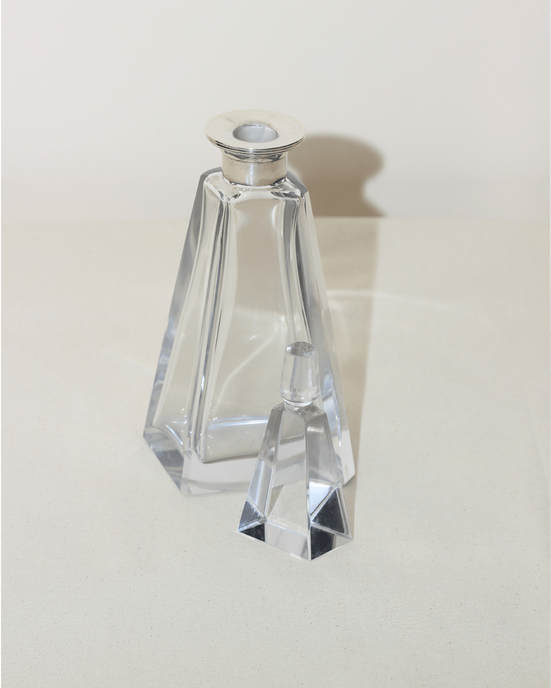 Art Deco Decanter — close-up of clear glass with silver top