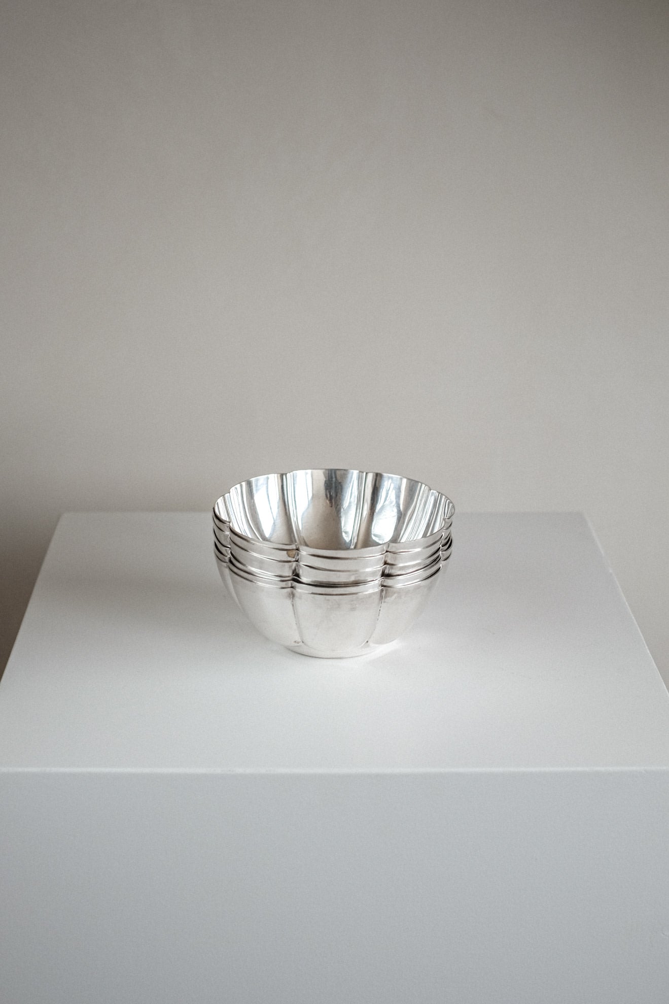 Set of 6 Silver-Plated Bowls 1960s — stacked bowls on white pedestal