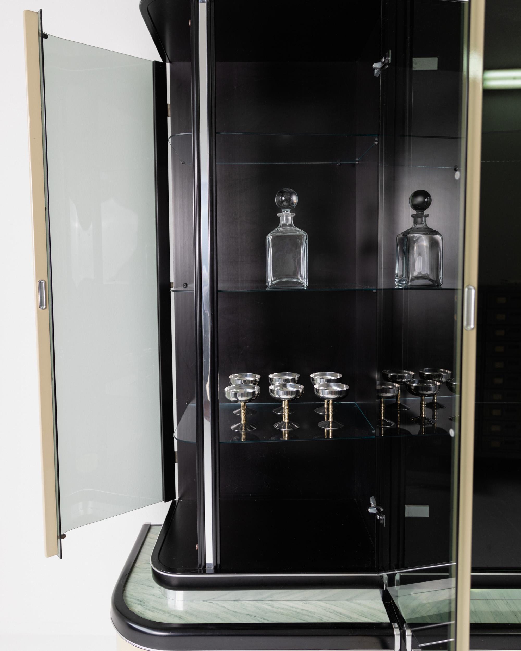 1950s Art Deco Bar Cabinet in Lacquered Wood — interior view with glass shelves and barware