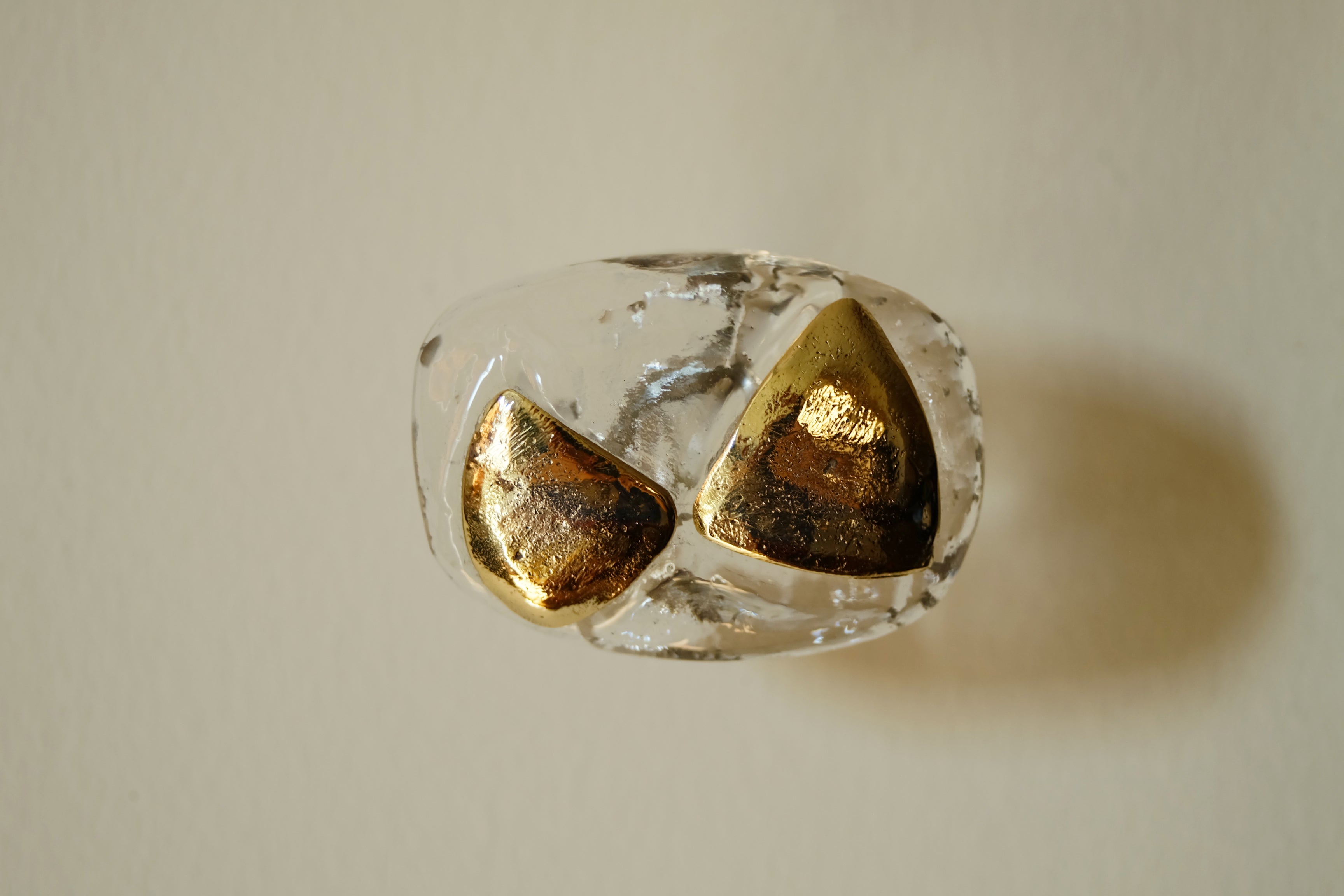 MIRO Cabinet Knob/Wall Hook — top view of clear glass with gold accents