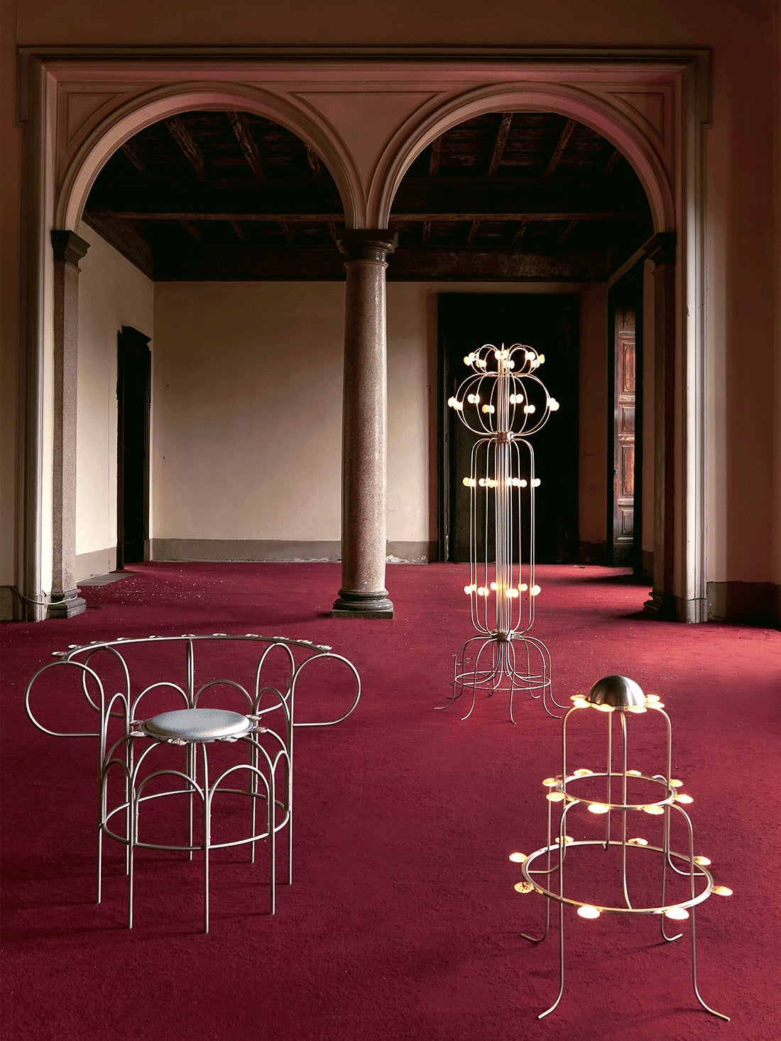 The Lamp With Shells — top view in empty room with red carpet