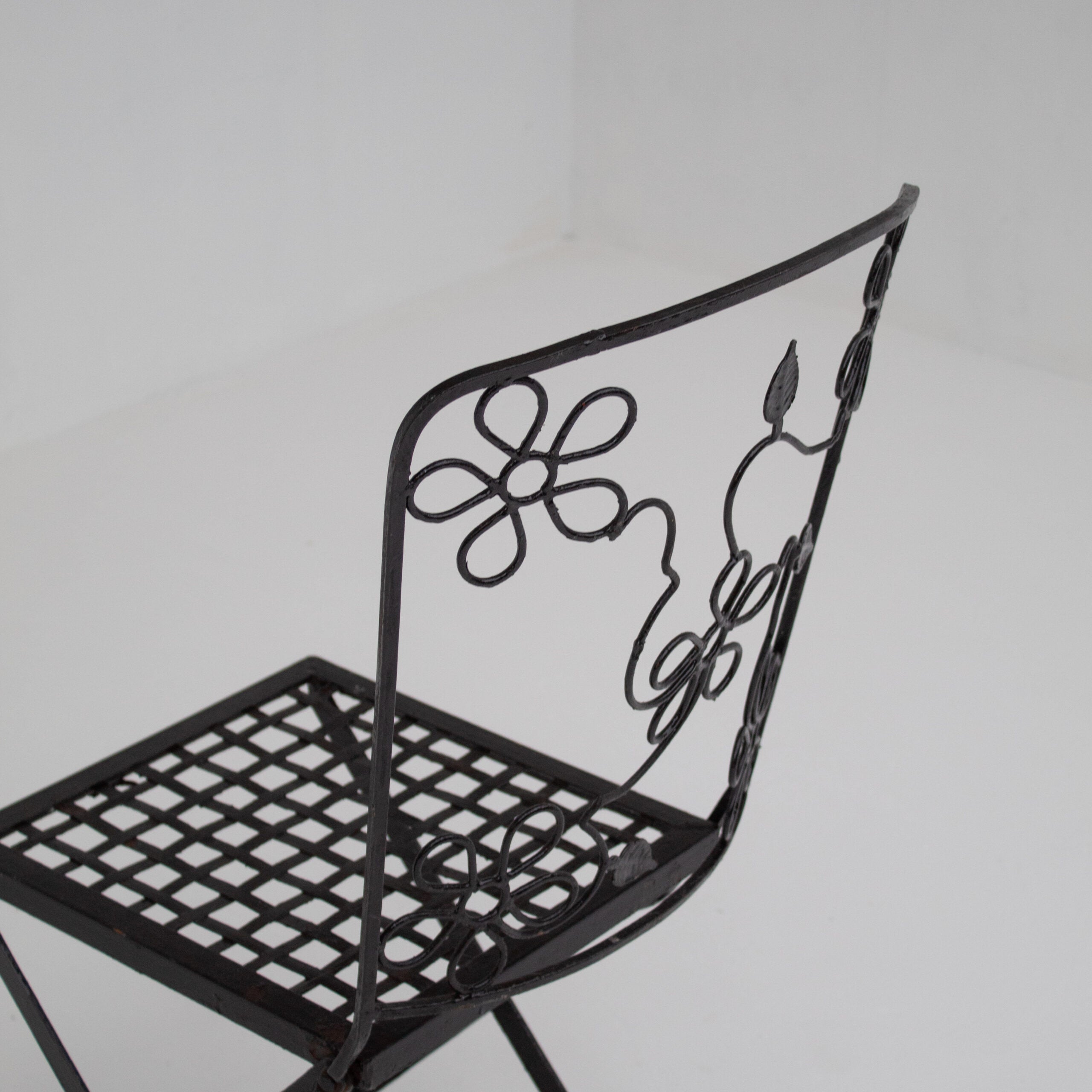 Set of Three Decorative Wrought Iron Garden Chairs with Floral Backrests — side angle