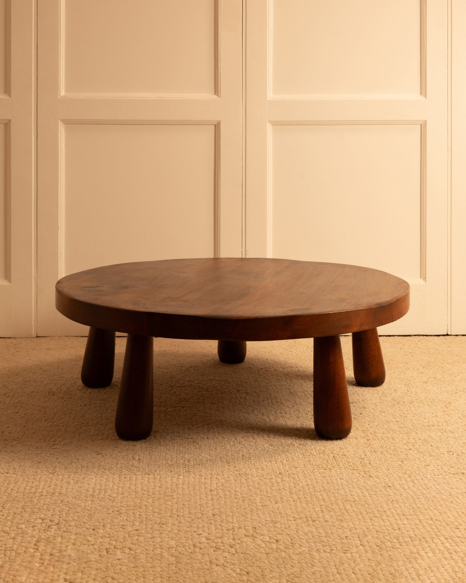Rounded walnut coffee table with chunky cylindrical legs, 1970s France
