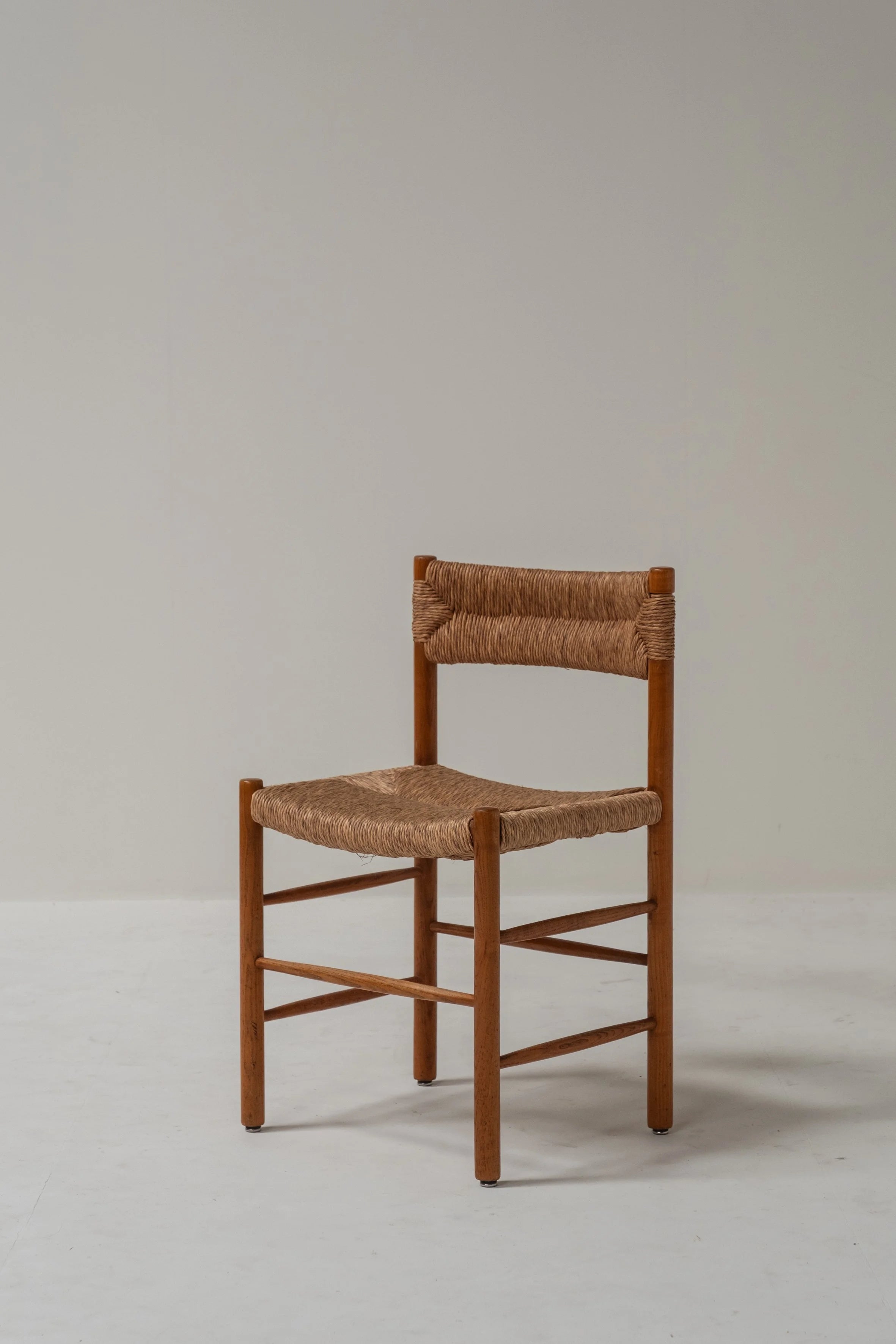 Set of 6 Charlotte Perriand Dordogne Chairs — lifestyle setting