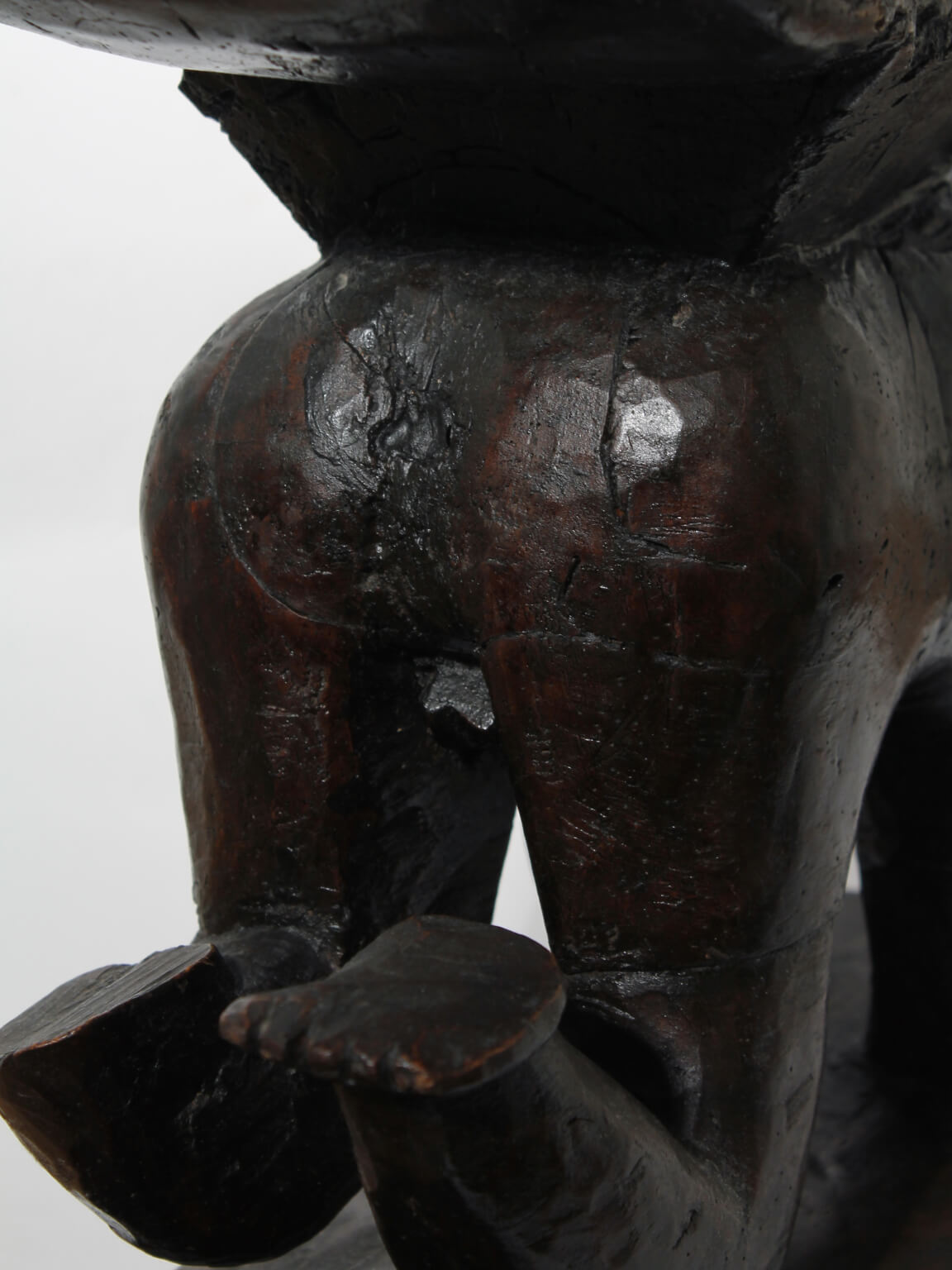 Large African Ashanti Figural Stool — back view highlighting carved wooden details