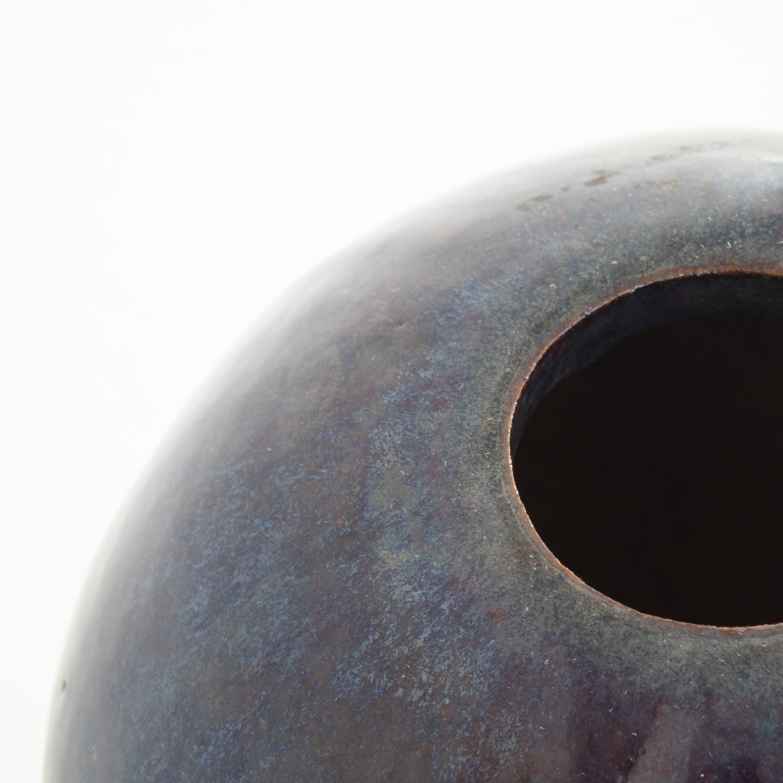 Vintage Spherical Ceramic Vase — side angle showing dark blue glaze