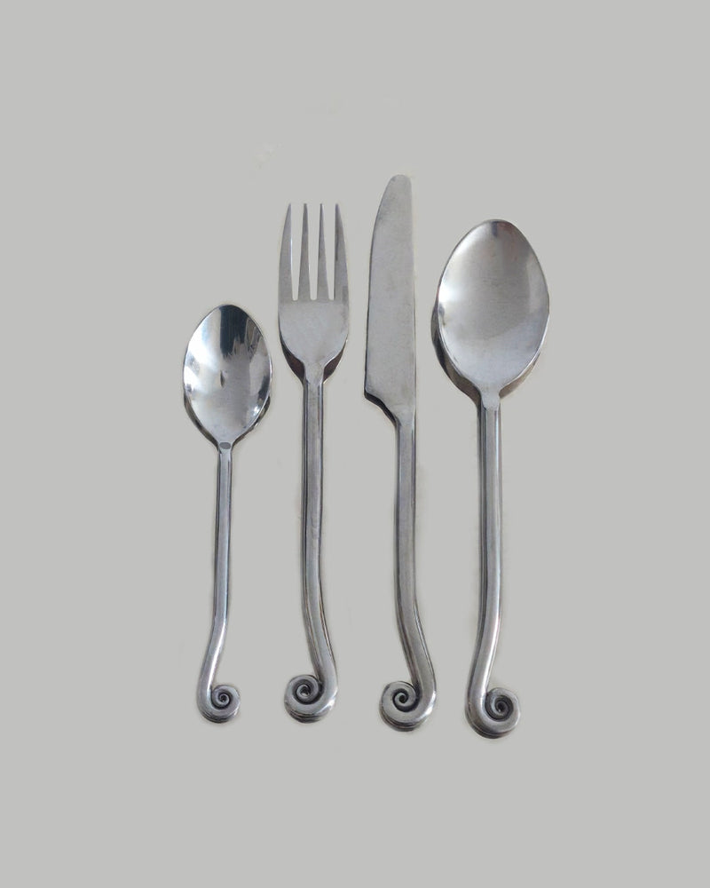 Four stainless steel cutlery pieces with elegant spiral handles