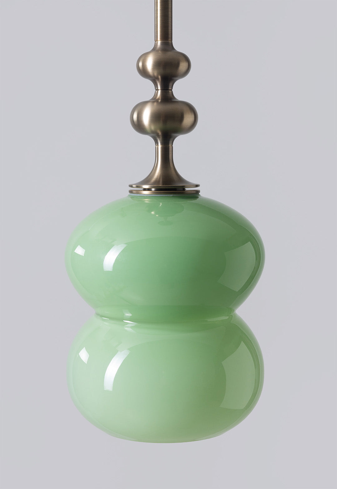 SkLO + AvroKO Oestre Pendant - Light Beige glass, Antique Brass finish — in context