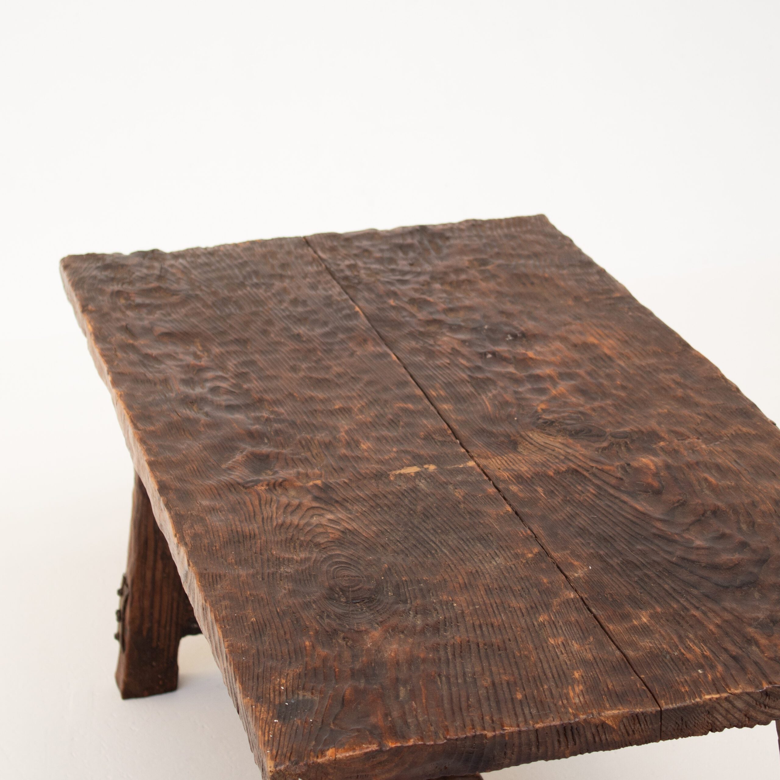 Brutalist Solid Wood Coffee Table — close-up of textured dark wood surface