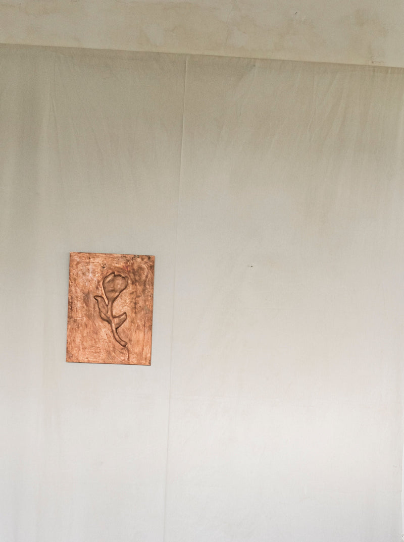 Rose' Chikanka — close-up of carved wood detail on wall