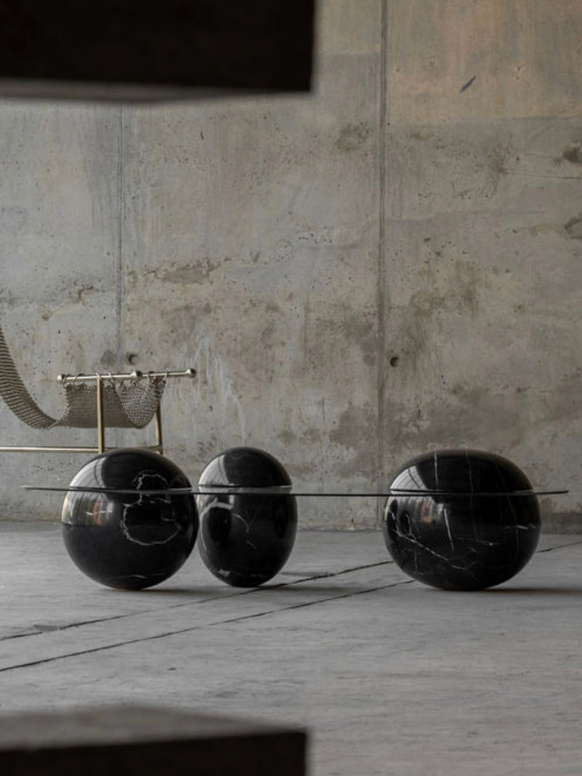 Ovni Uovo' Coffee Table — side angle showing black marble spheres