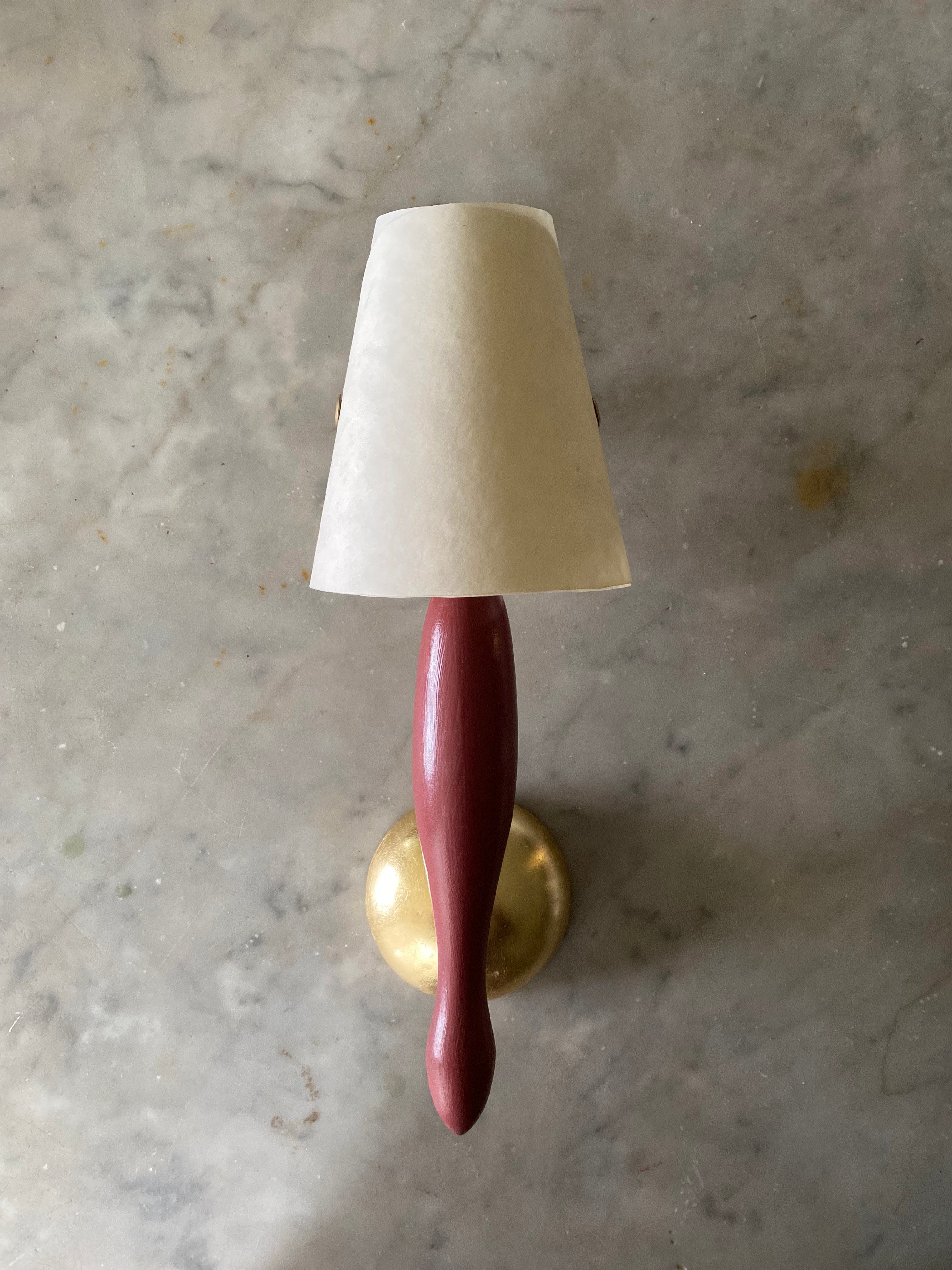 CALYX WALL LIGHT D;1992 RELAUNCHED 2024 — top view of red wooden base and cream shade