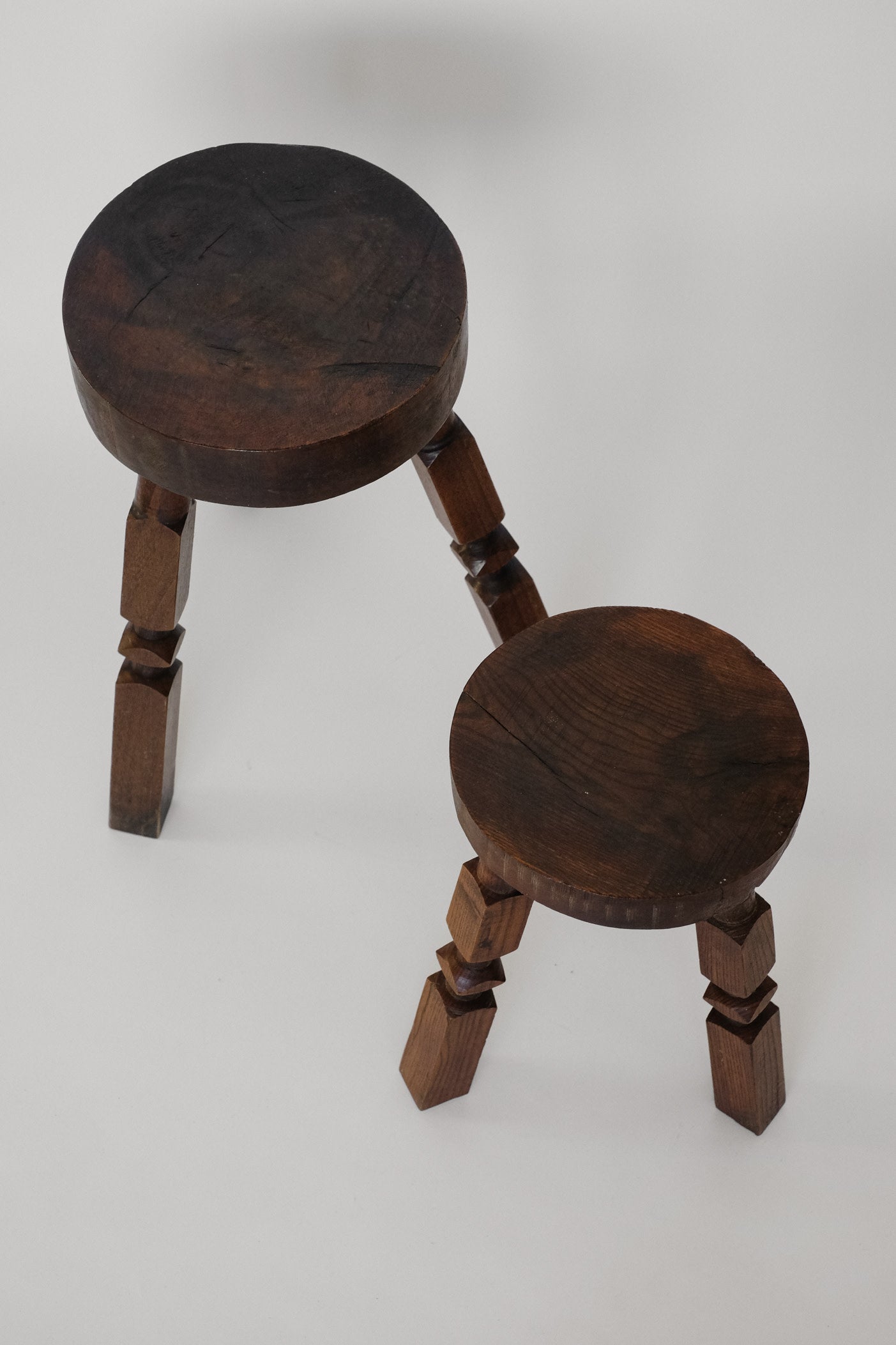 Pair of Mid-Century Rustic Tripod Stools — close-up