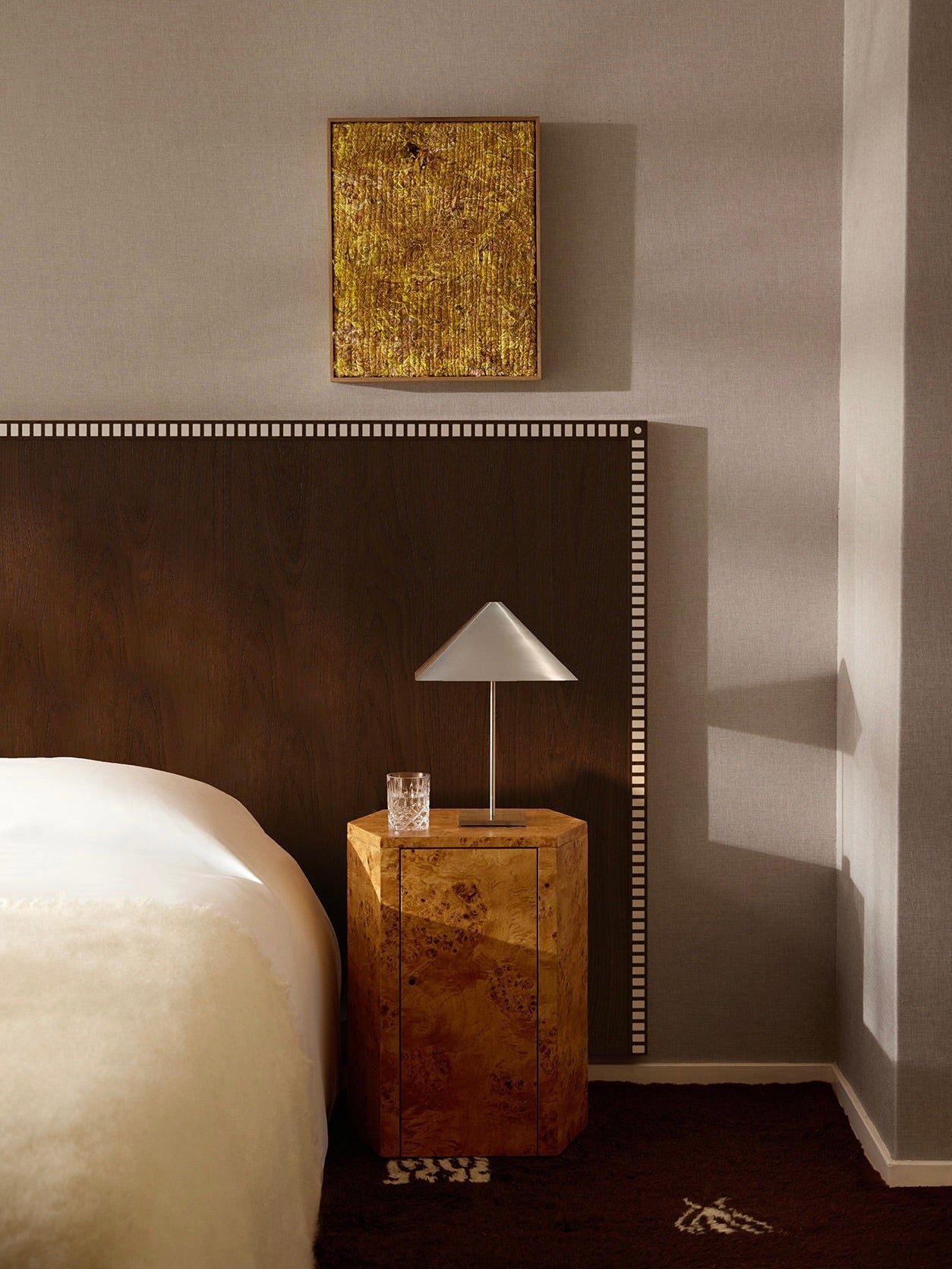 Aquarama Headboard in Chocolate Ash — detail of headboard against textured wall