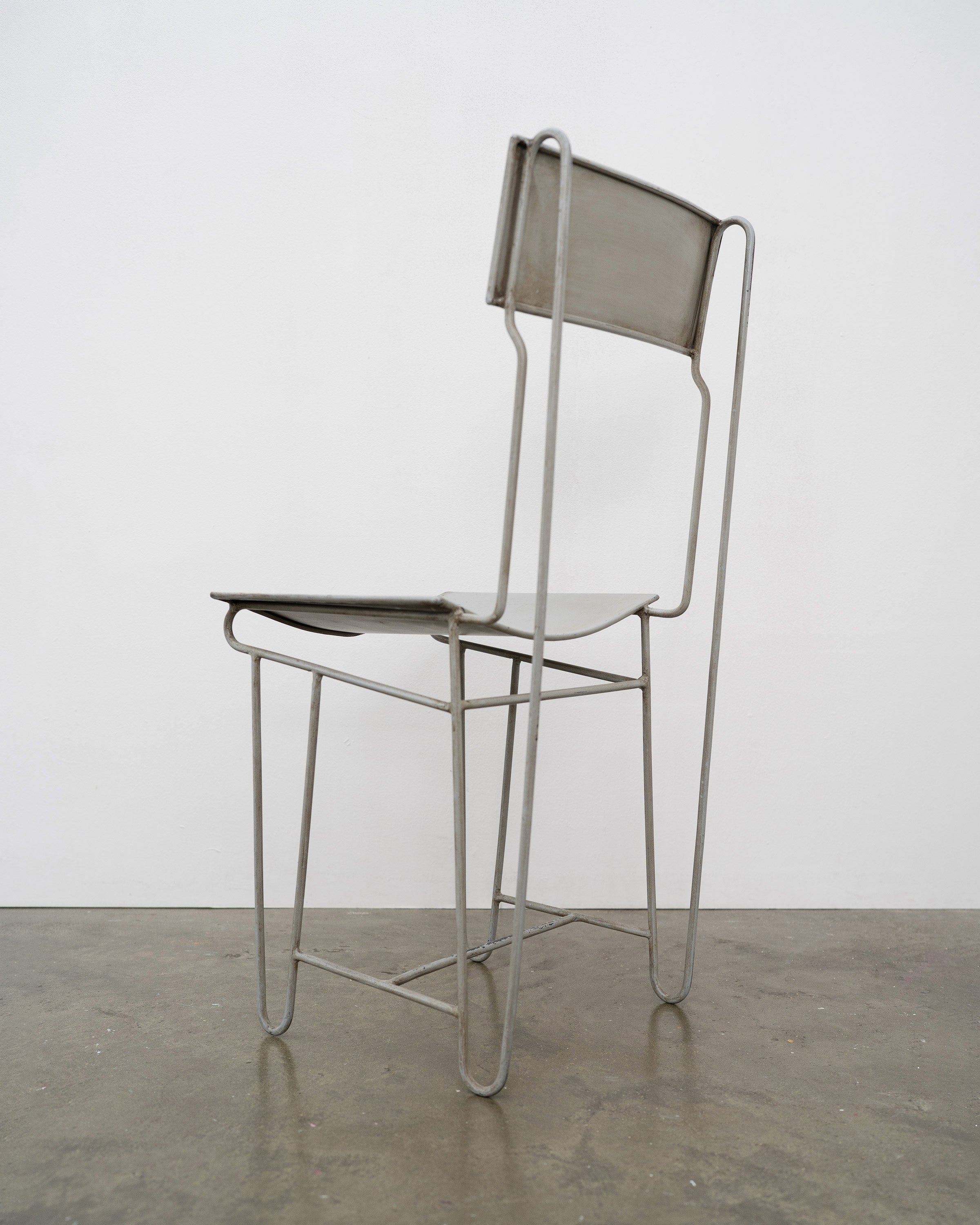 Modernist Steel Chair — back view highlighting metal frame and minimalist design
