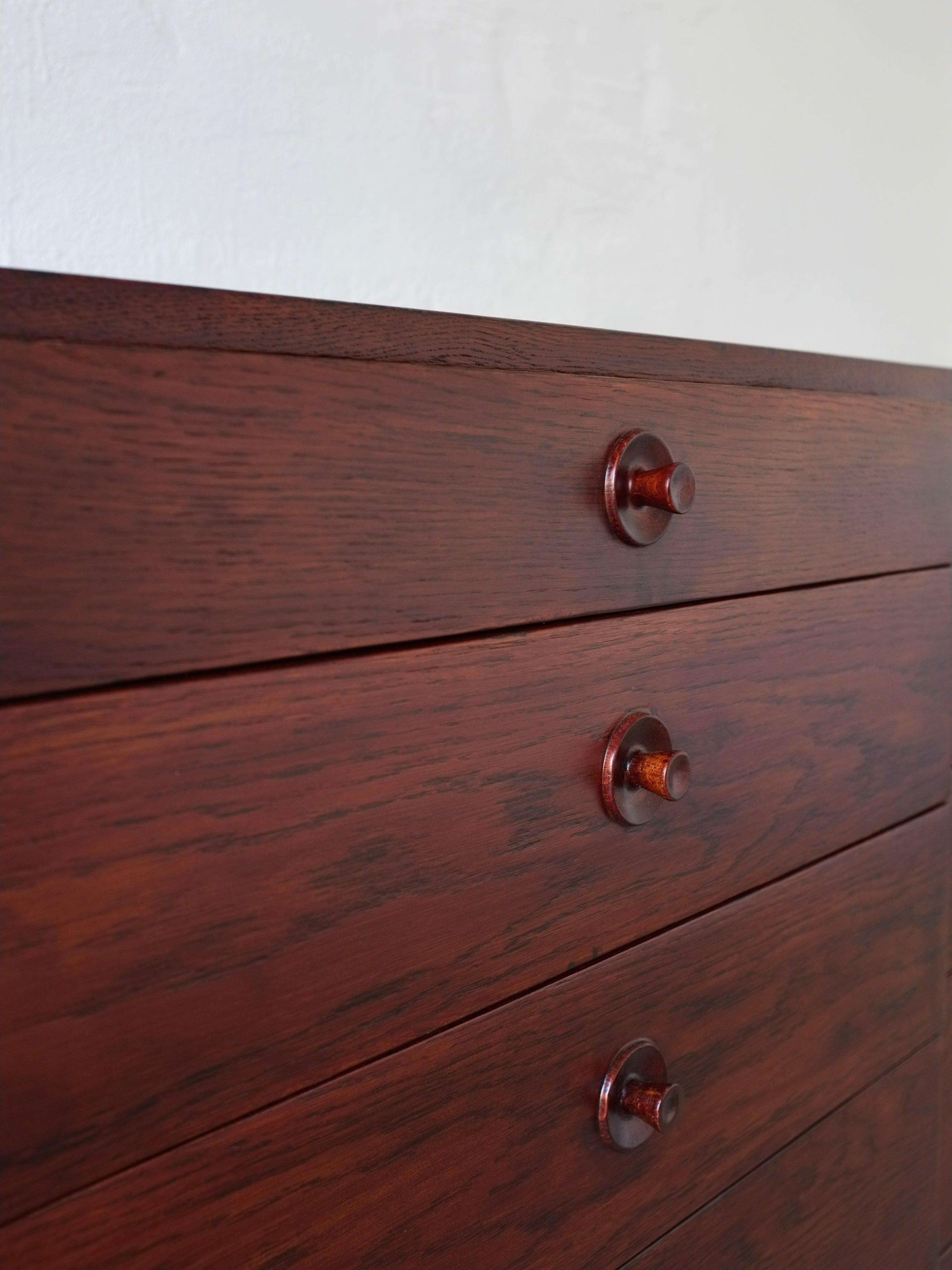 Chest of Drawers by Borge Mogensen for Karl Andersson's, Denmark 1950s — angled view highlighting rich wood grain and round k