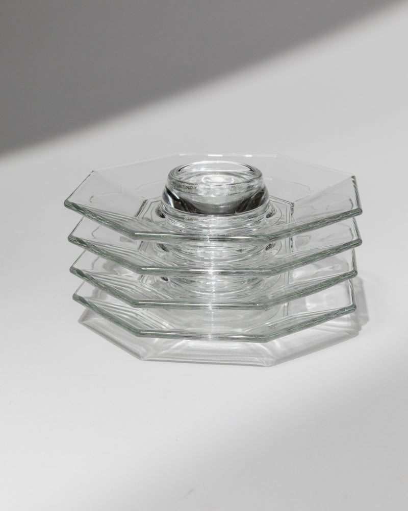 Stacked clear glass egg cups showing stepped Art Deco design