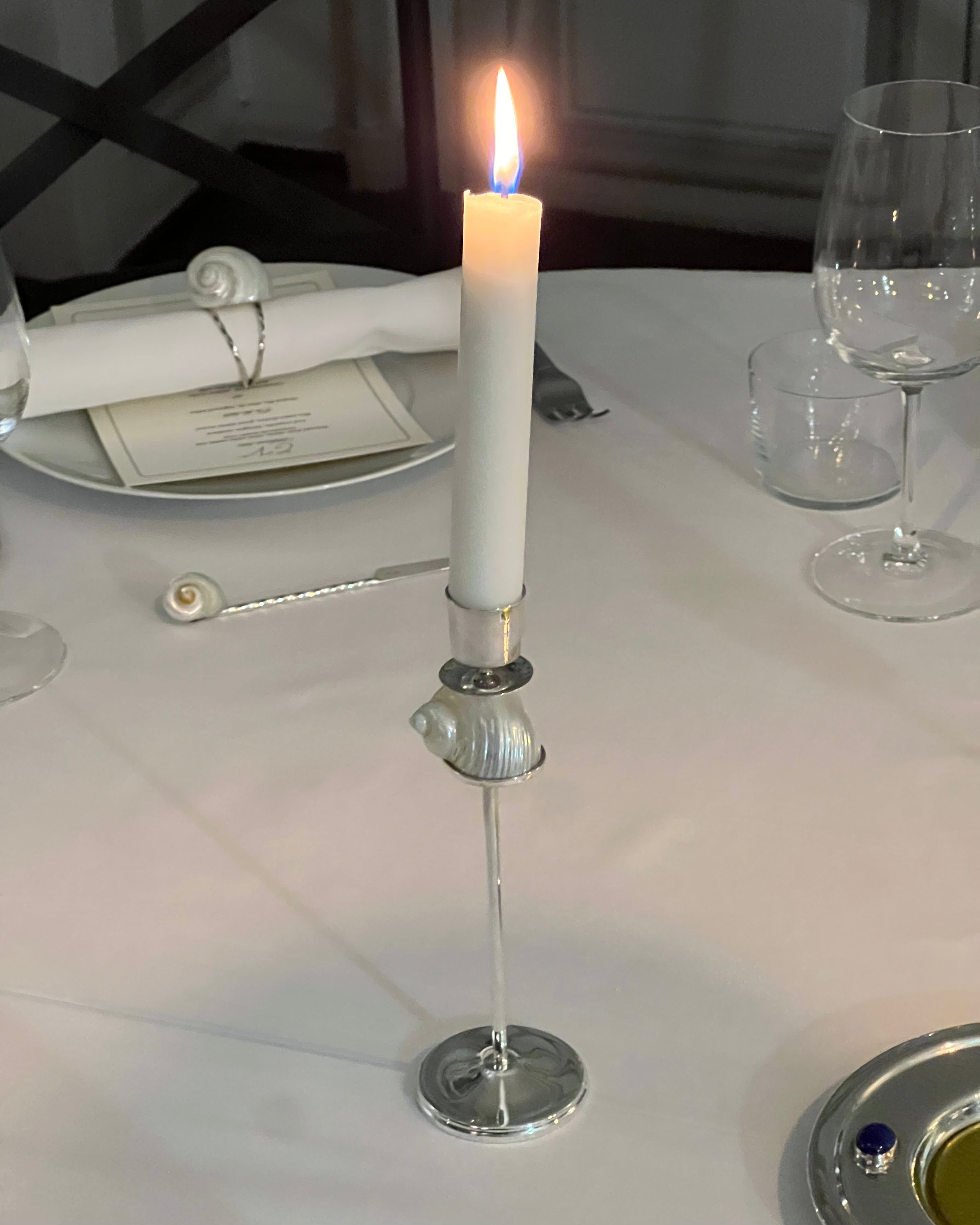 Silver Spiral Candleholder — close-up with white candle on dining table