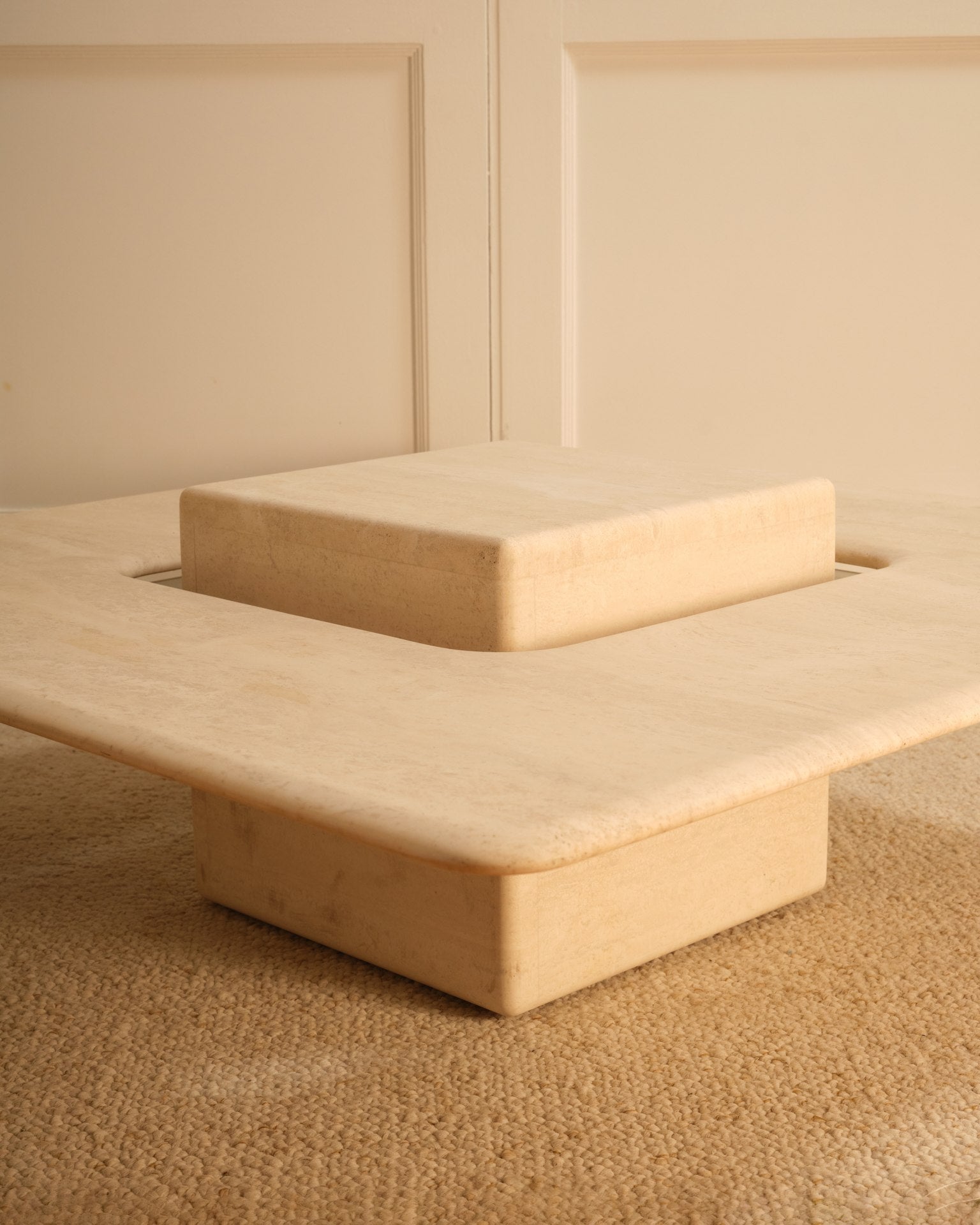 Saturn travertine coffee table corner detail showing layered geometric form