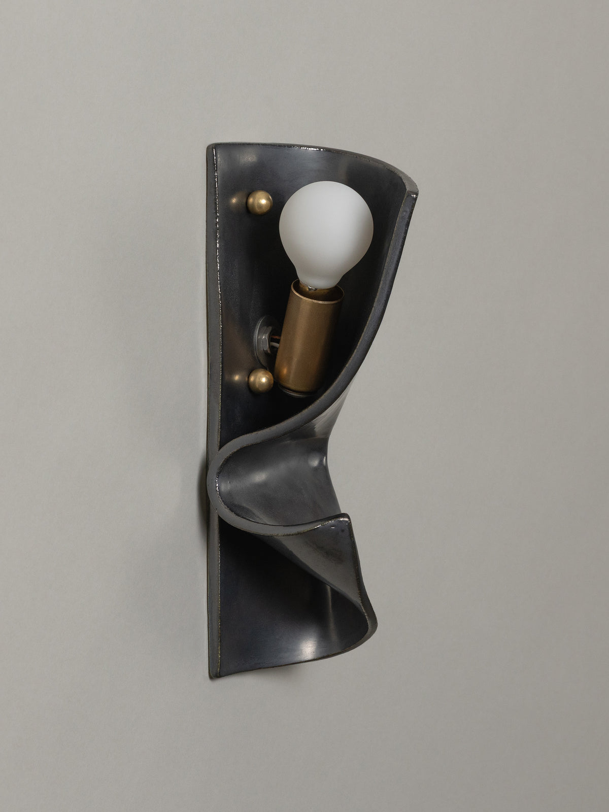 Shai Sconce Graphite, Left — lifestyle setting