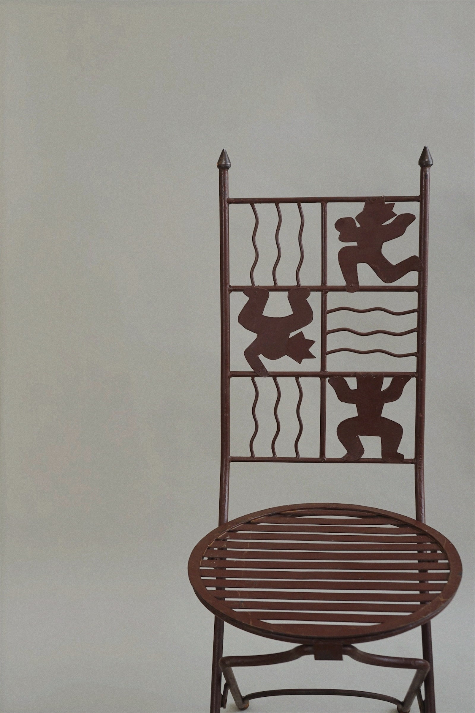 Iron Chair with Stylised Figures c.1980 — side angle