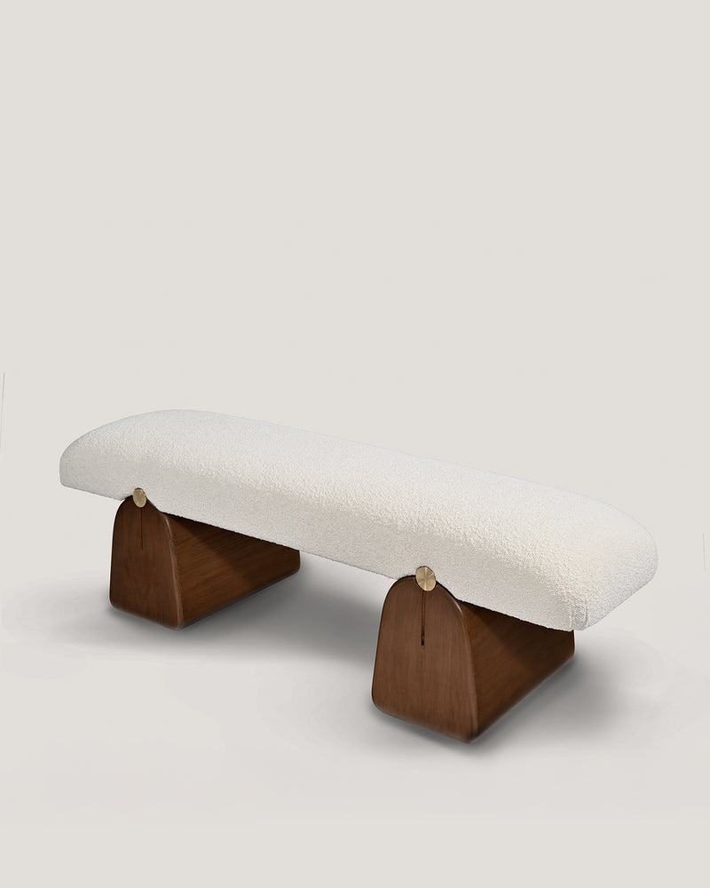 IO bench with cream upholstered seat on walnut wood supports