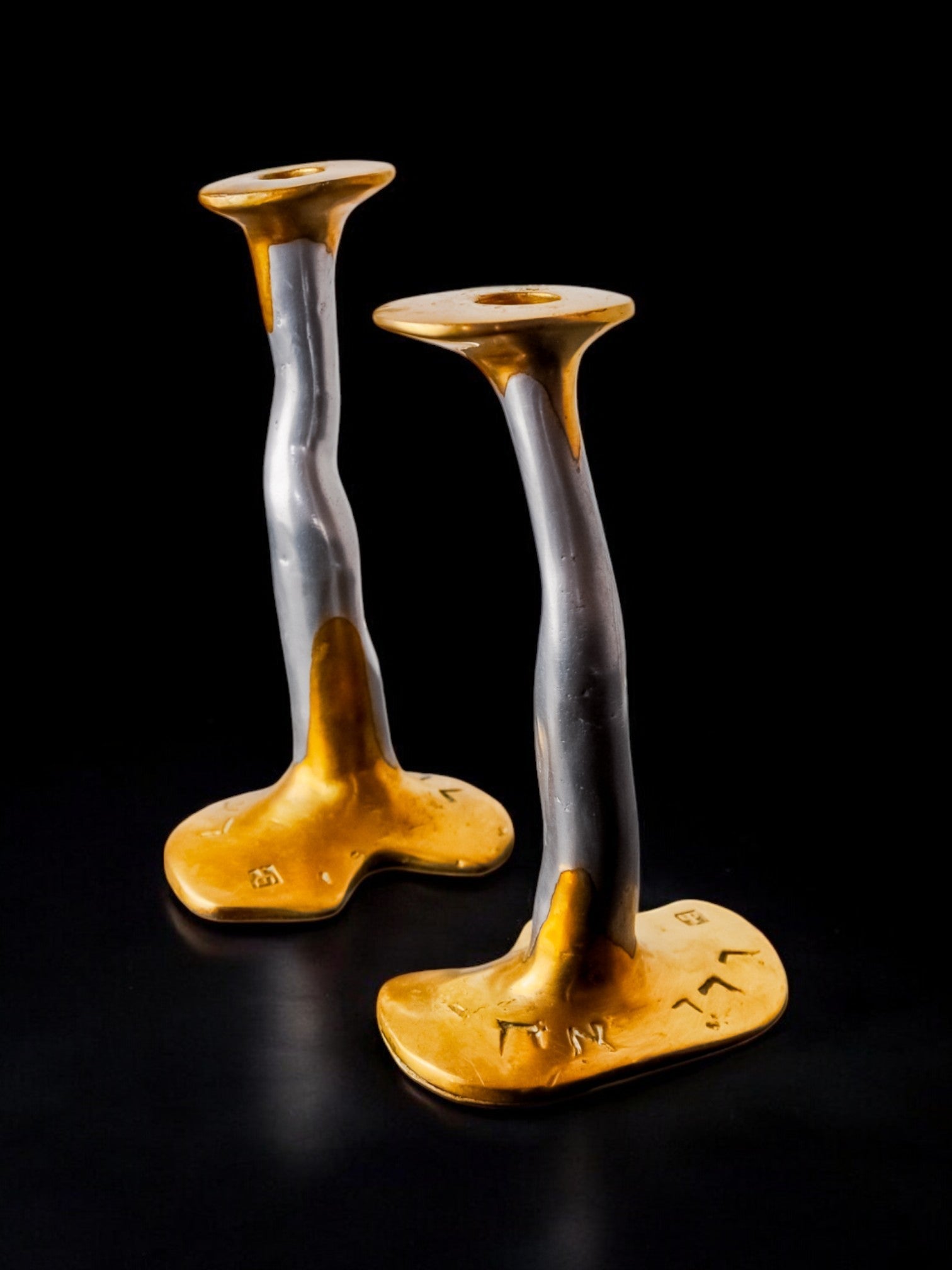 Pair of Brutalist Candleholders by David Marshall, 1980s — angled view on black background