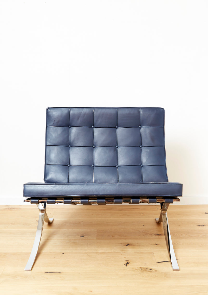 Barcelona chair in navy leather with tufted cushions and chrome frame