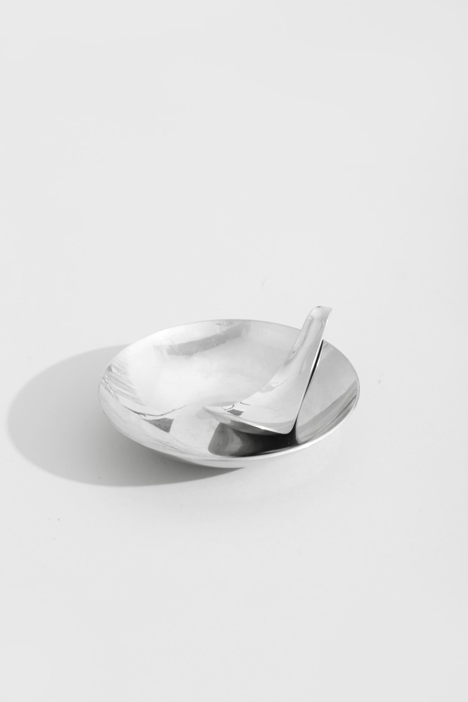 Sculptural Chrome Dish and Spoon — lifestyle setting