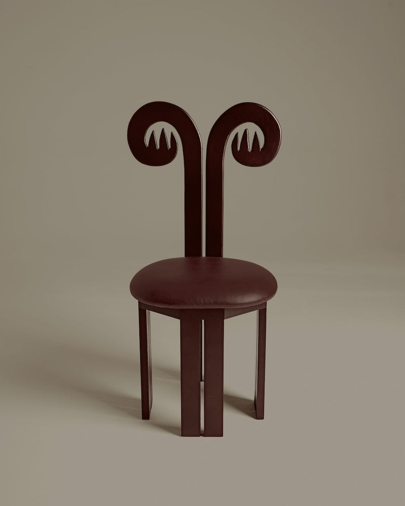 Fiamma dark wood chair with distinctive curved spiral backrest