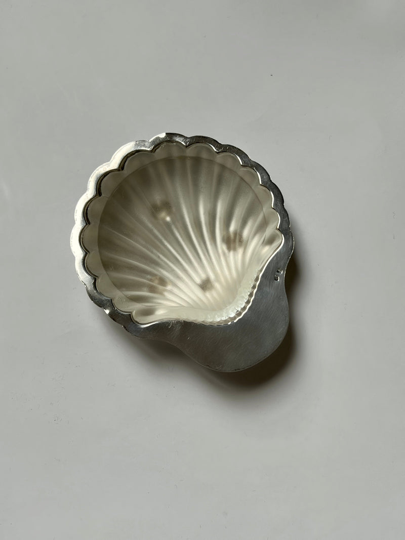 Silver shell-shaped decorative dish with scalloped edges