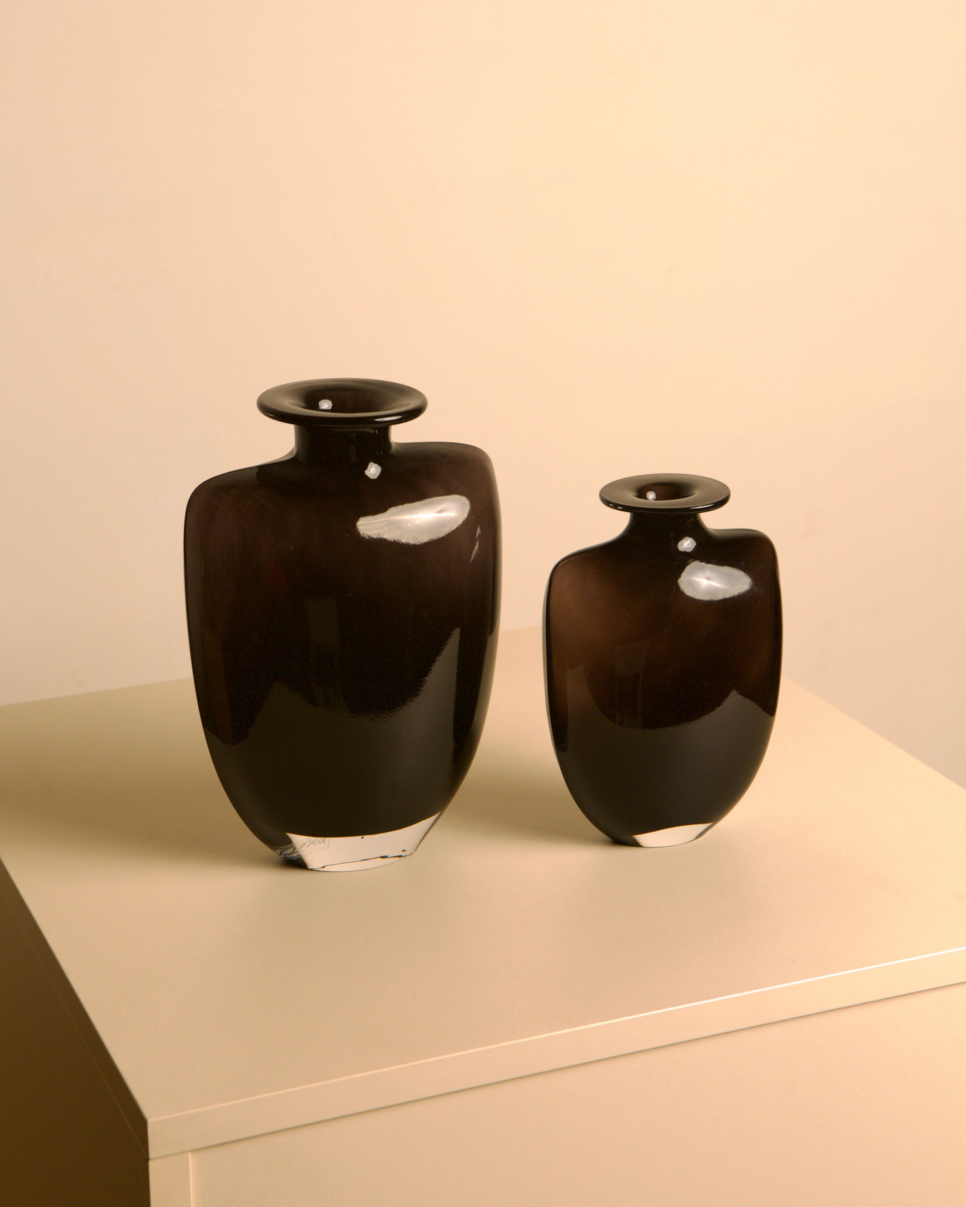 Pair of dark glass vases, Kjell Engman for Kosta Boda, Sweden, 1980s — detail view