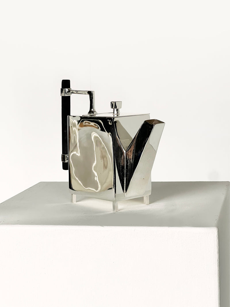 Christopher Dresser Square Ornate Teapot — close-up of polished metal surface