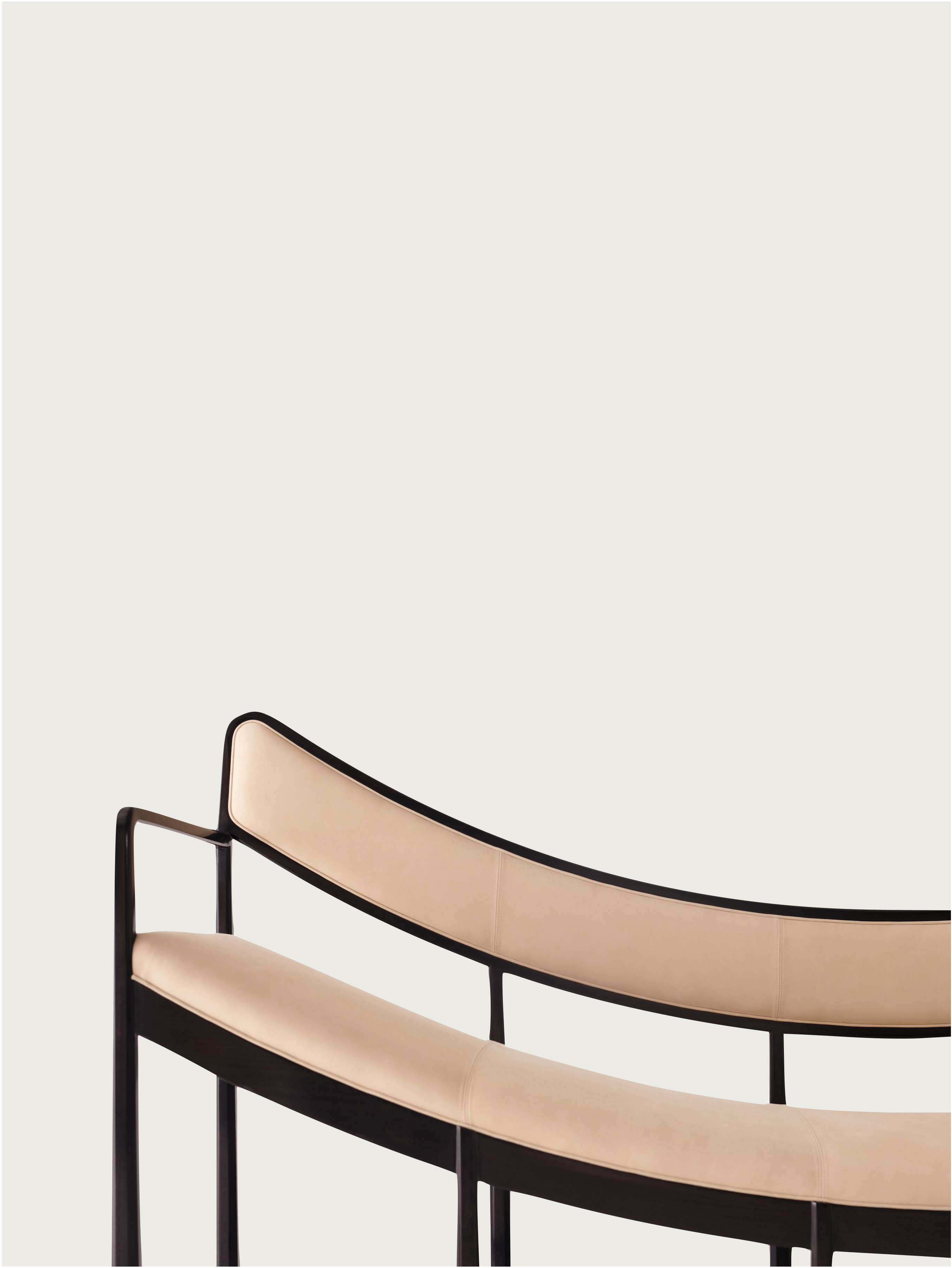 Daybed Sofa — side angle showing curved leather seat and metal frame
