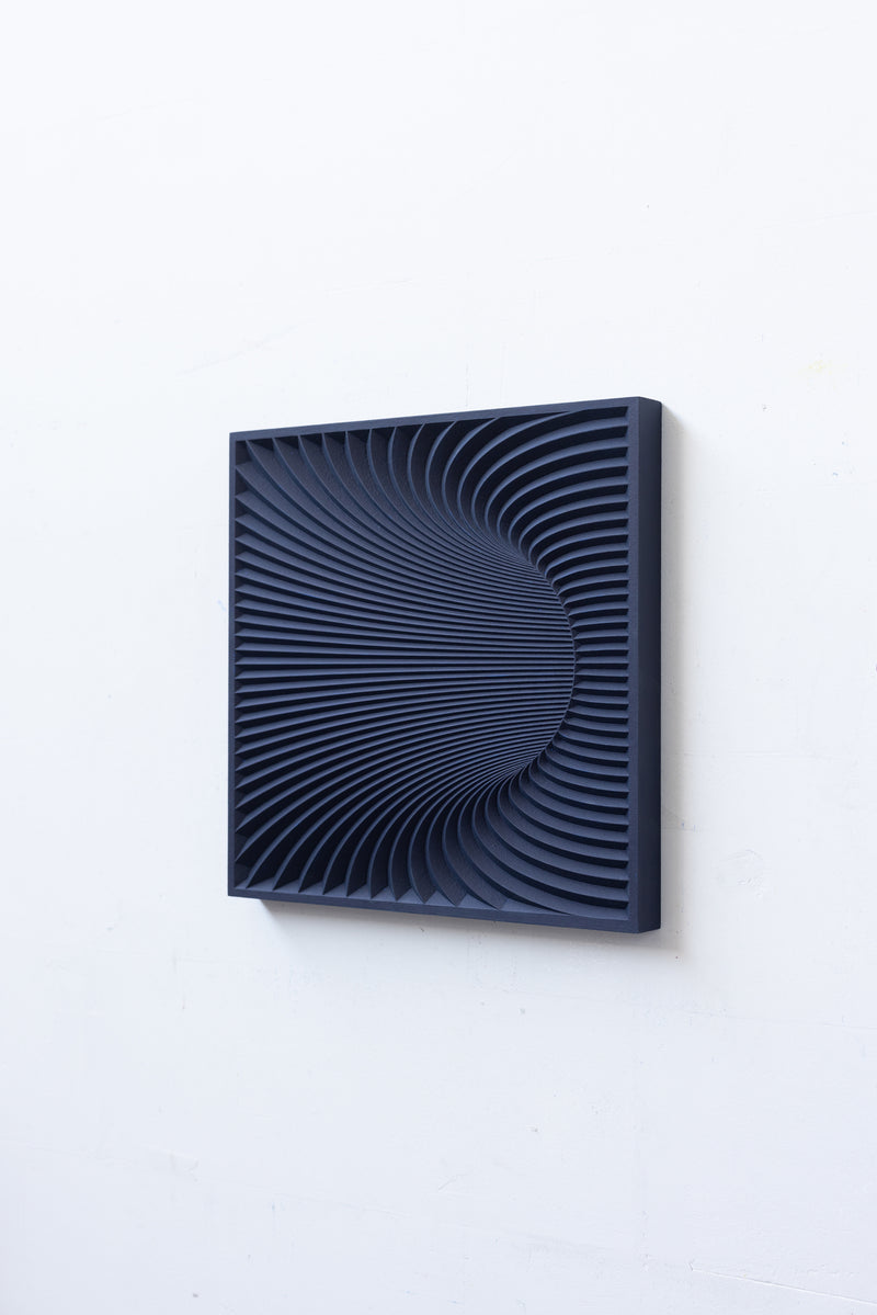 Wormhole Sculpture — close-up of textured dark blue surface