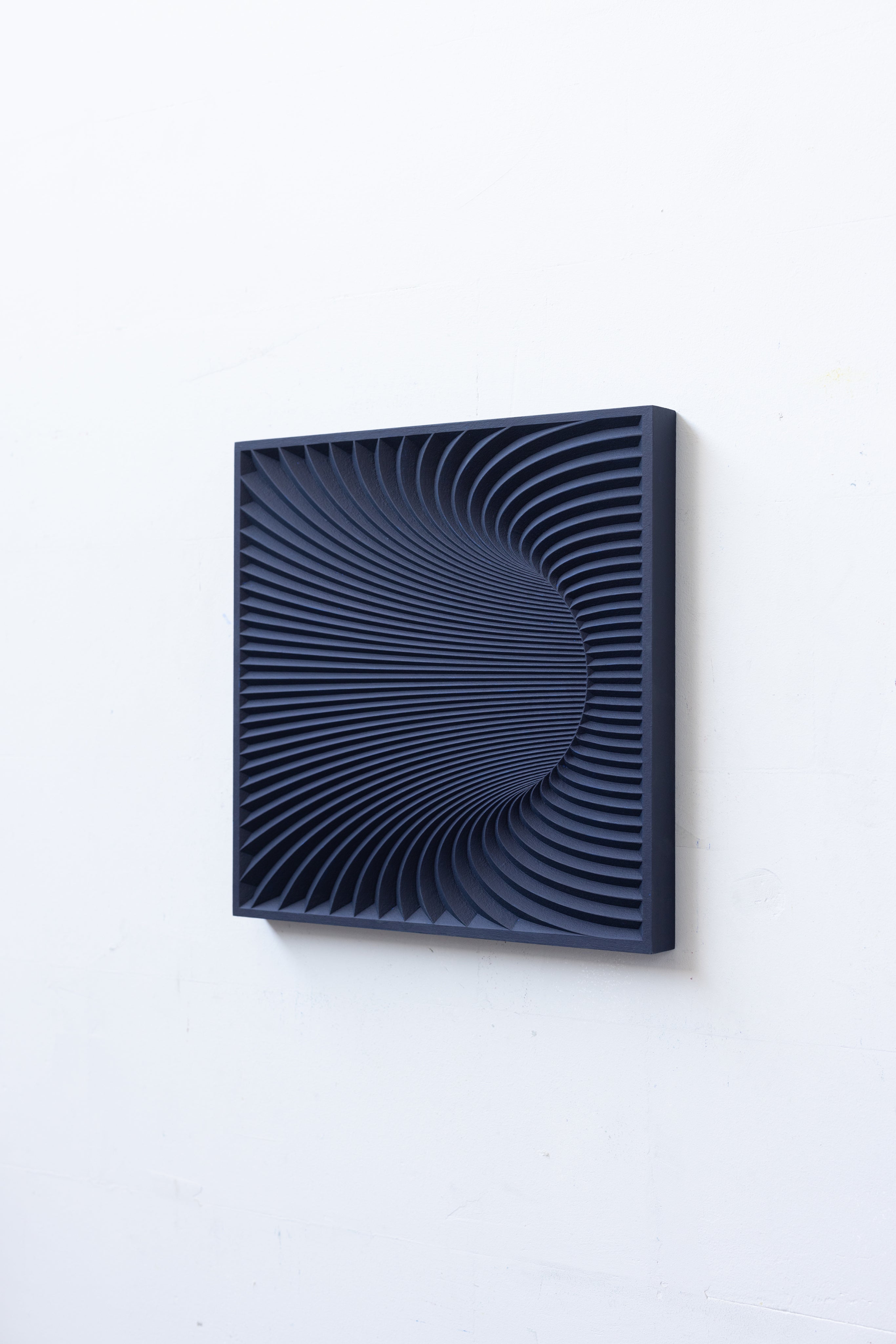Wormhole Sculpture — close-up of textured dark blue surface