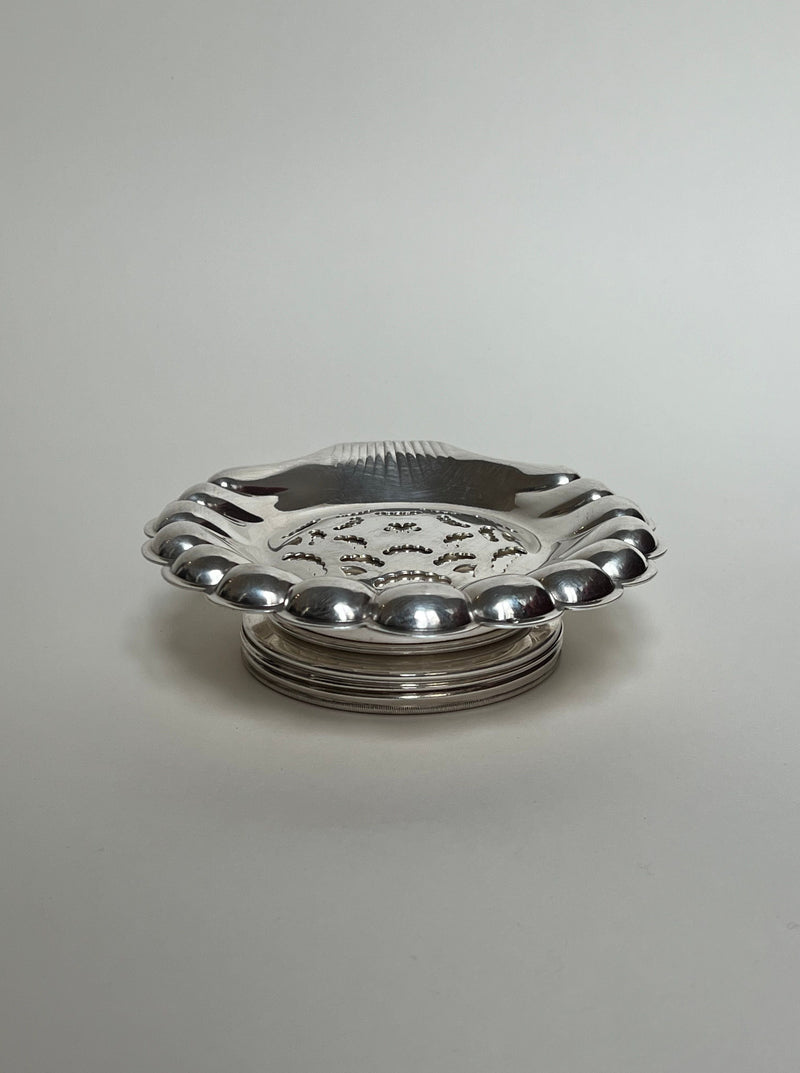 Vintage silver shell-shaped butter curler with scalloped edges