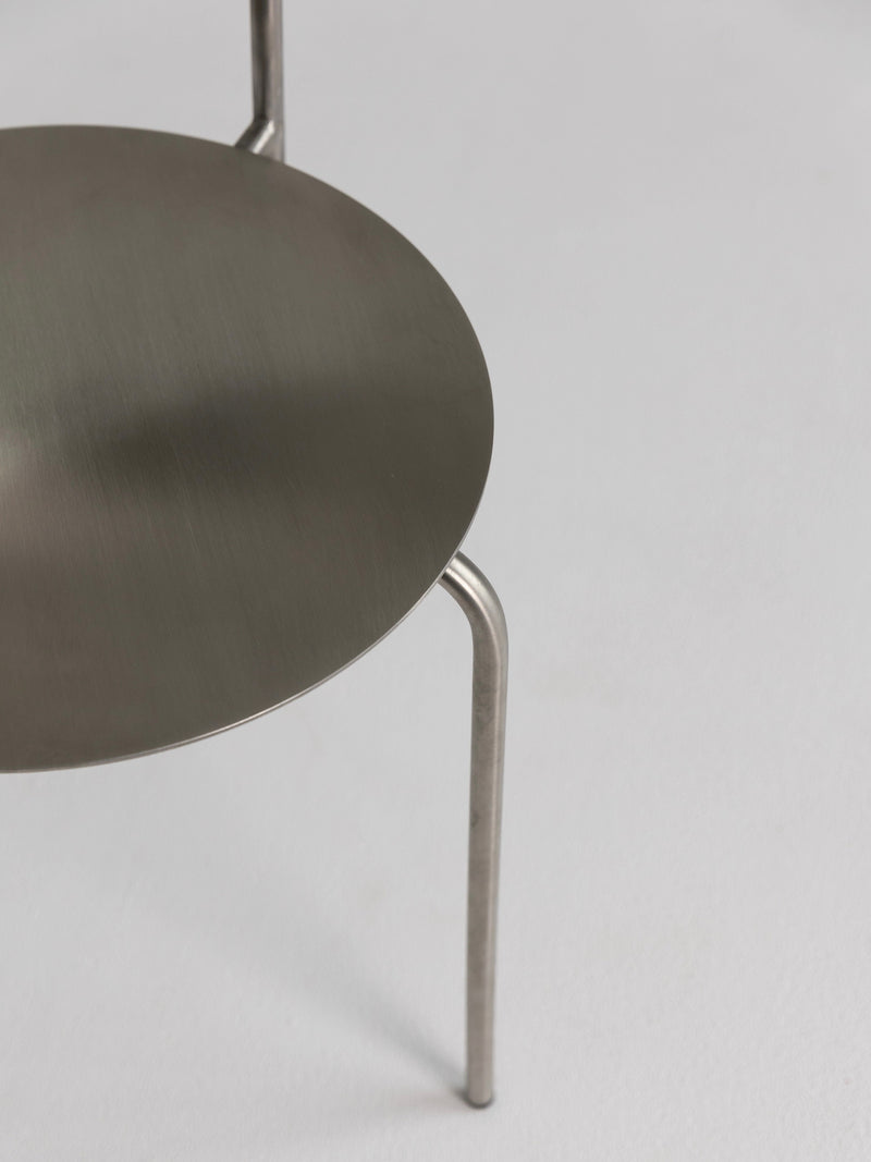 Meadow Stainless Steel Chair — close-up of round metal seat