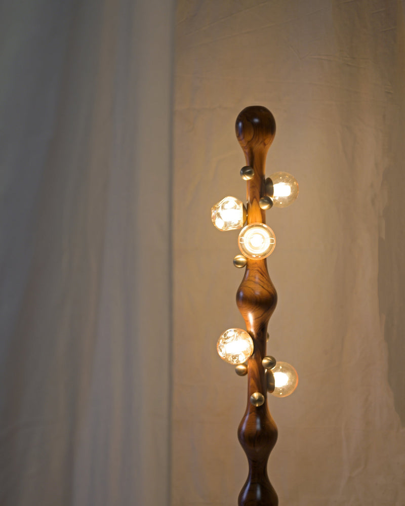 Stem Floor Lamp — close-up of wooden body with glass bulbs