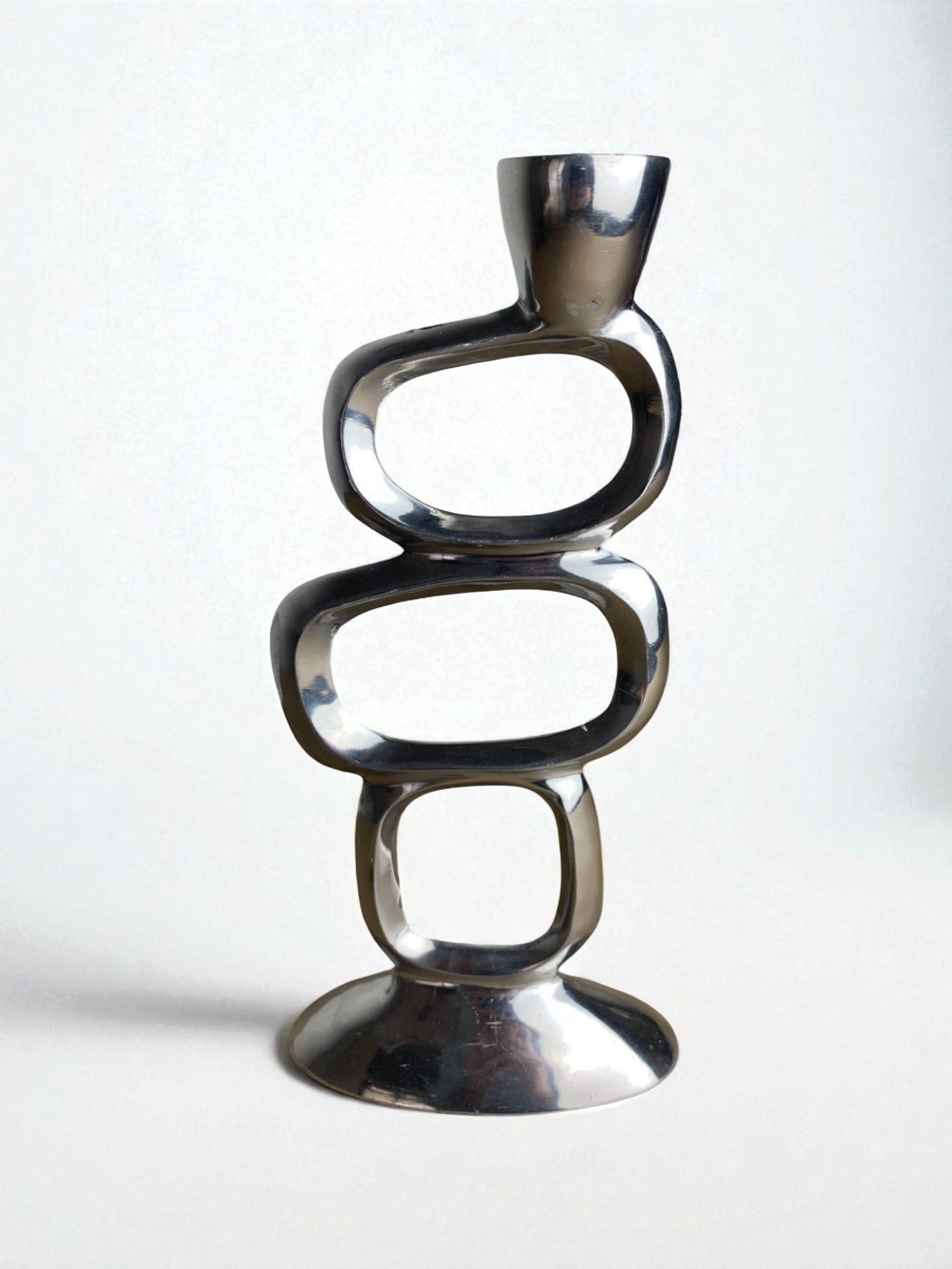 Circle Candleholder by Matthew Hilton, Aluminium, 1980s — close-up of polished aluminium surface
