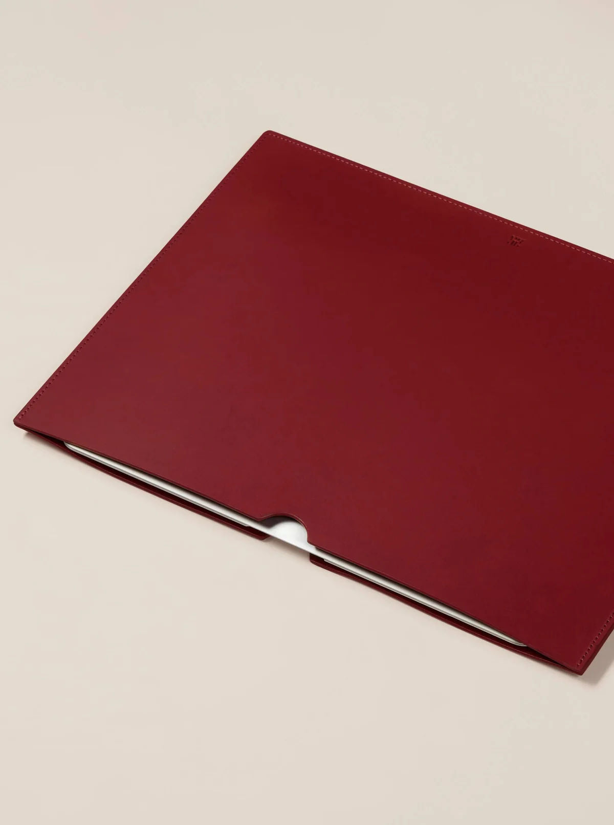 Leather Laptop Sleeve — top view of deep red leather surface