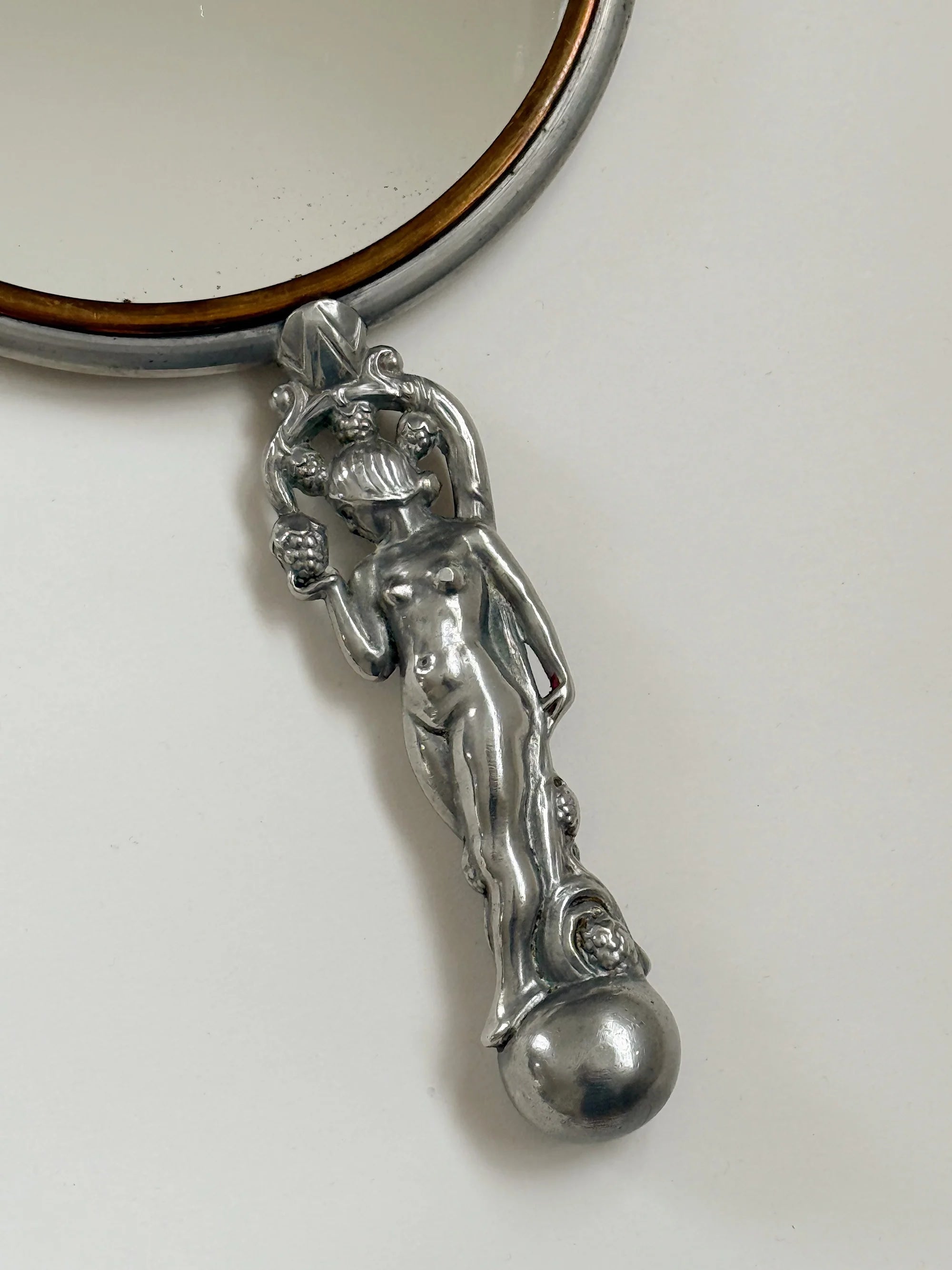 CG Hallberg Hand Mirror in Pewter, Swedish Grace, 1933 — side angle showing detailed handle design
